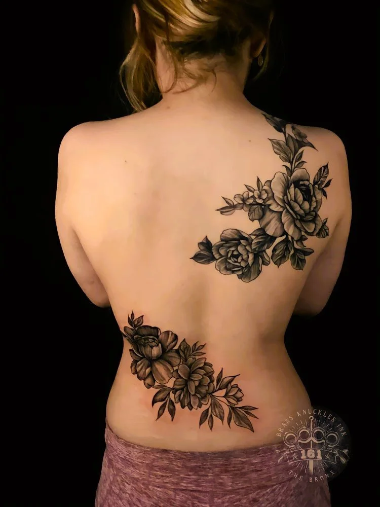 Delicate floral back piece professional Bronx tattoo studio in NYC.