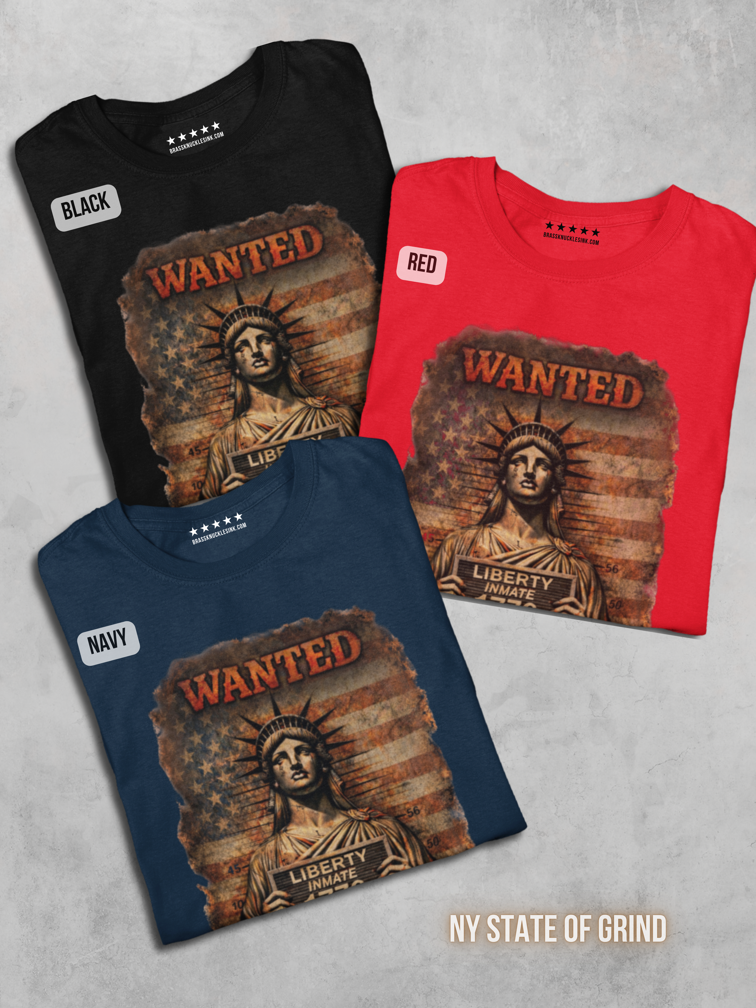wanted-liberty-folded-black-red-blue-t-shirts-flatlay-mockup.png