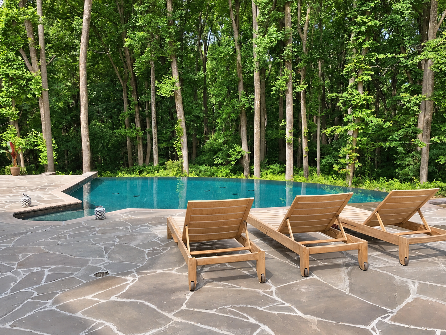 Woodland pool with a flagstone terrace and space for poolside relaxation.