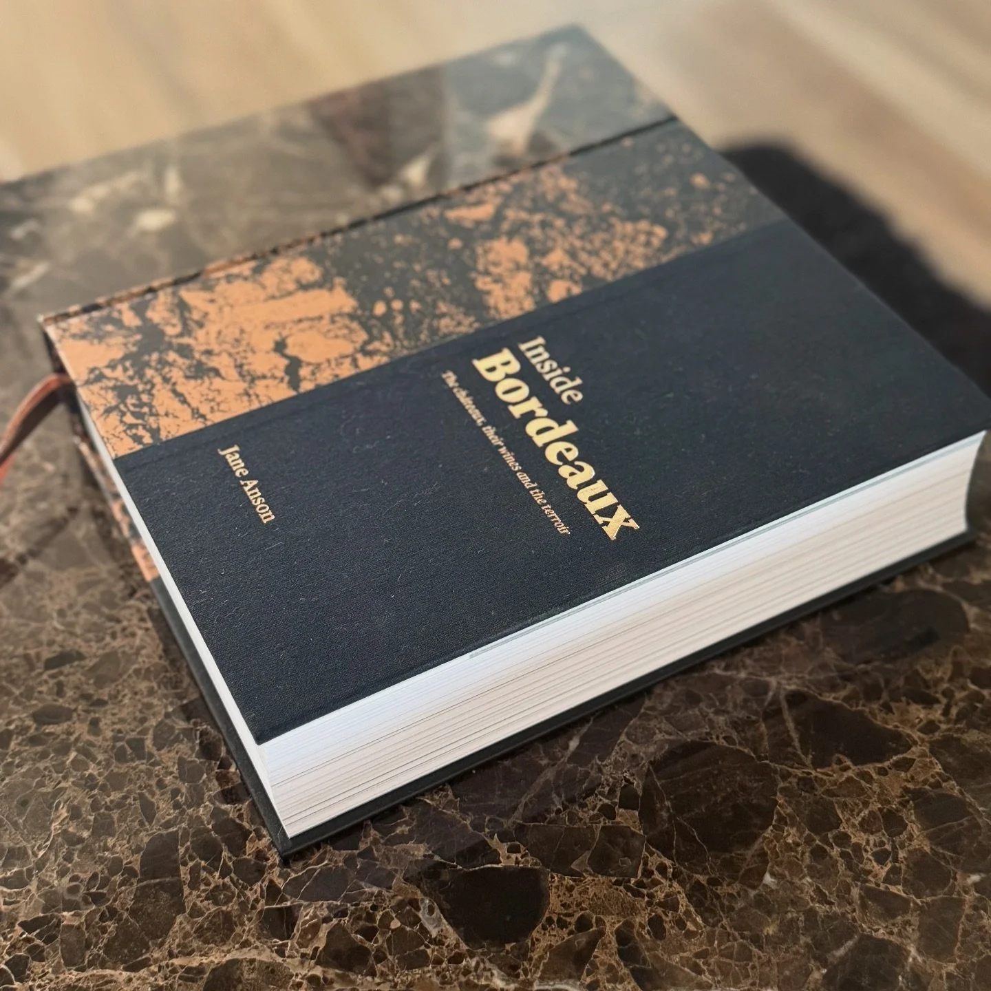 I&rsquo;d been looking for a side table to add to my living room, and I kept going back to this marble. I couldn&rsquo;t figure out why I loved it so much, but I went for it!
I recently unpacked some of my wine books that had been boxed up for a move