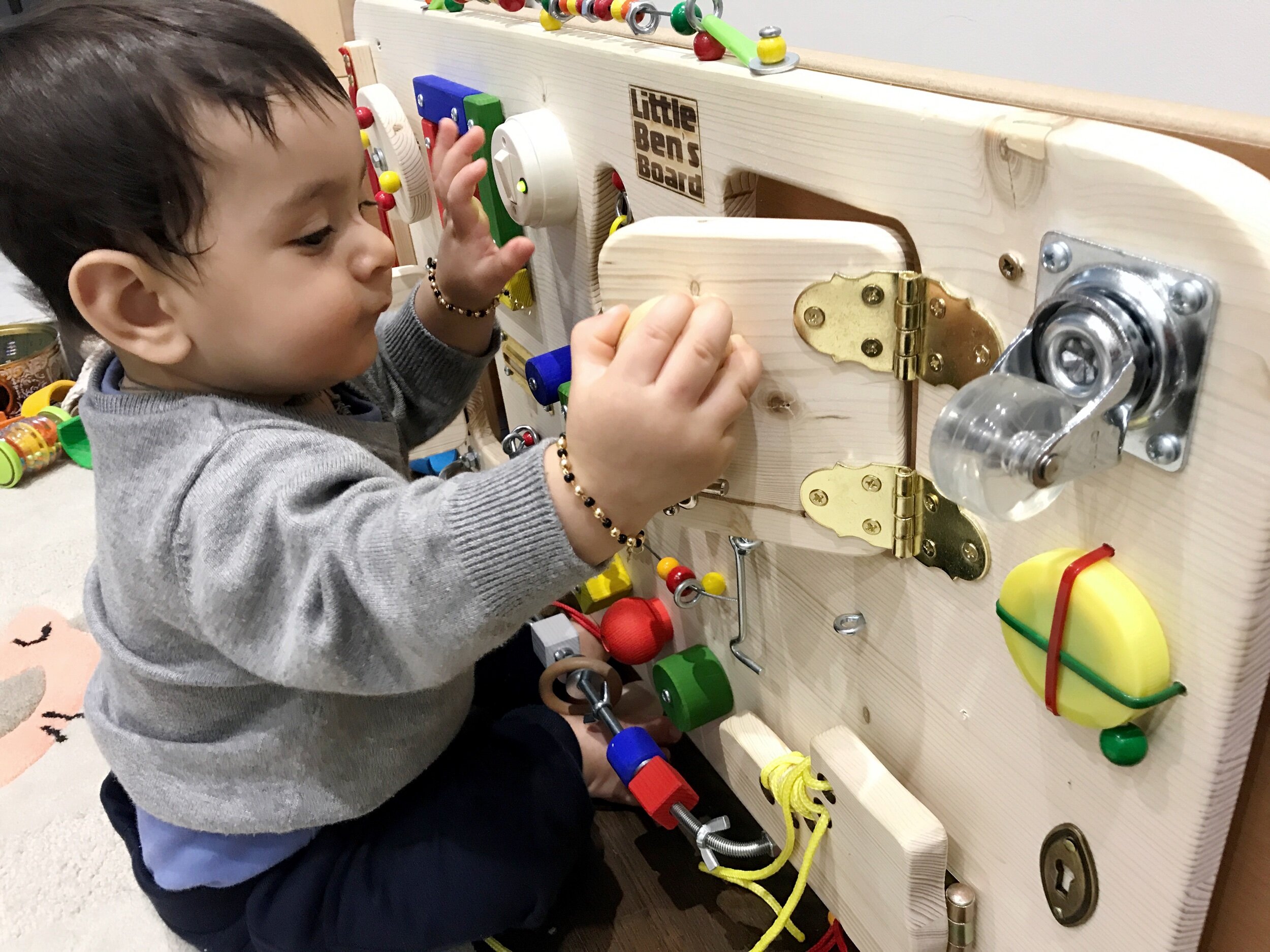 How to Make a DIY Busy Board for a Busy Toddler