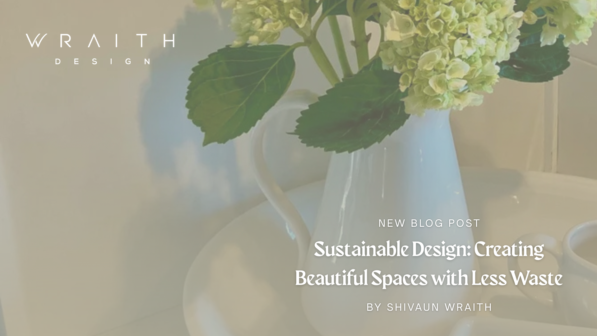 A white ceramic pitcher filled with green hydrangea flowers and large green leaves, on a white table. Text overlay indicating a blog post about sustainable design.