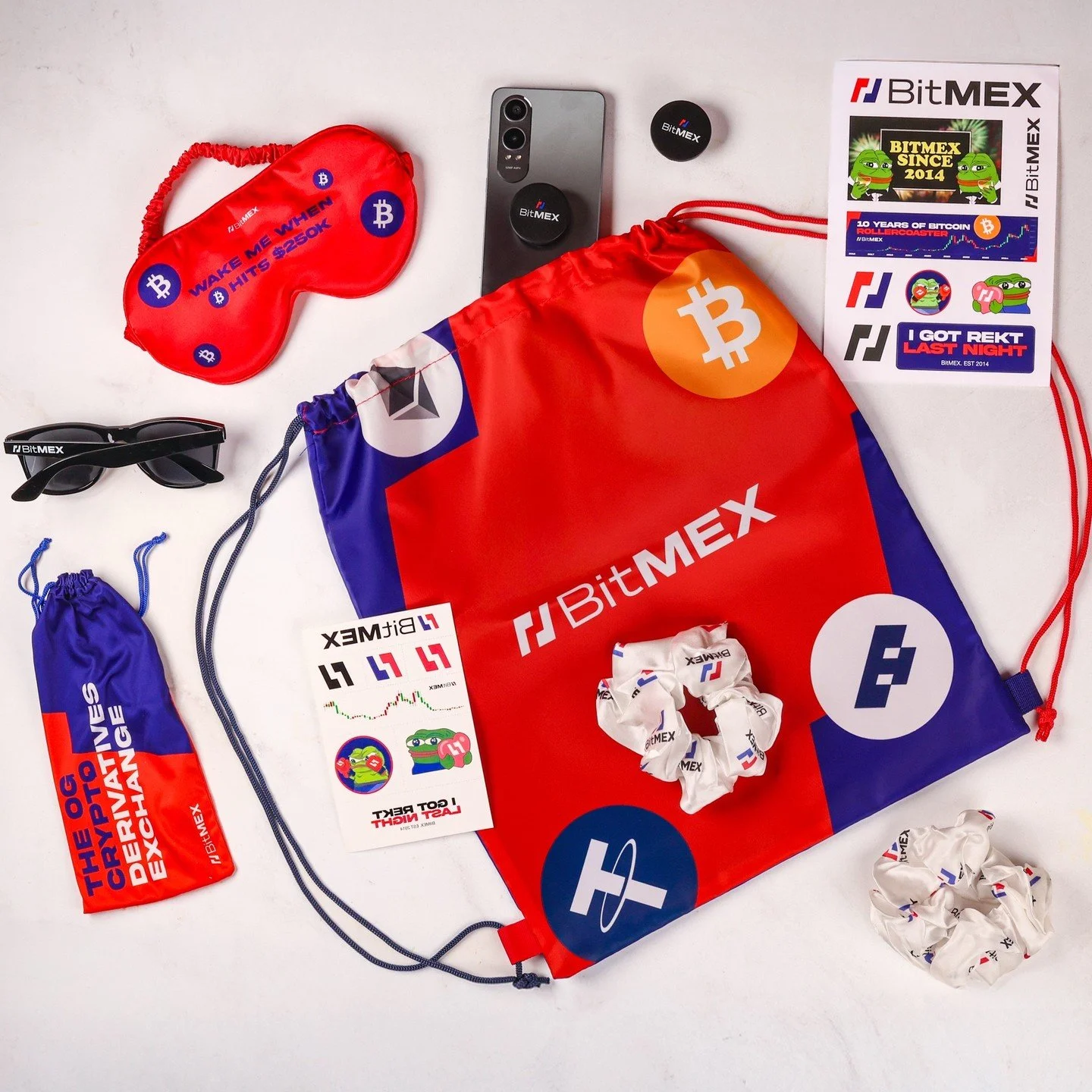 At TOKEN2049, BitMEX proved that the best merch isn’t what gets handed out, it’s what gets used.
Custom drawstring bags, scrunchies, stickers, and sunglasses turned into everyday brand carriers, creating real visibility beyond the booth.