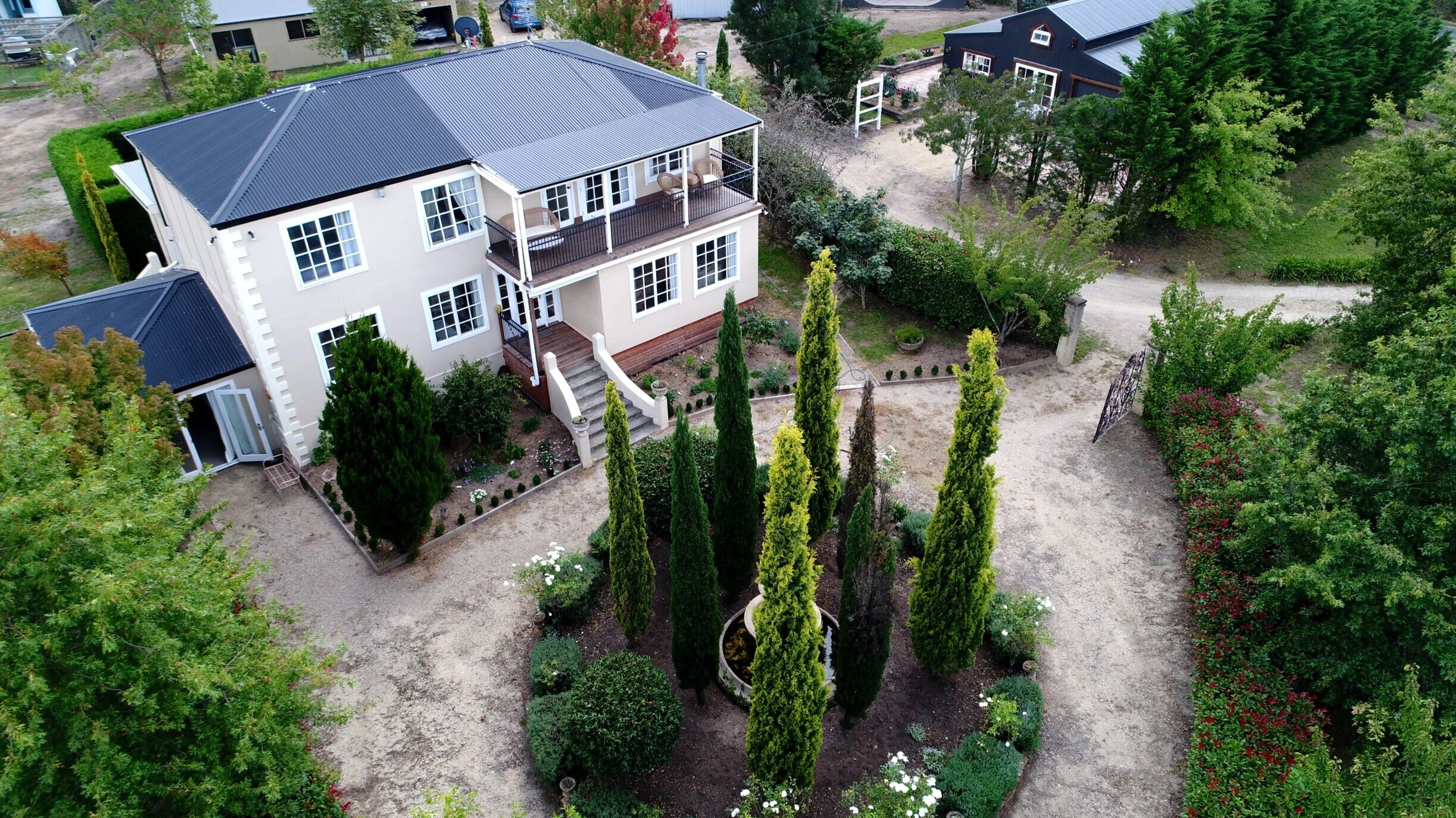 View of the grand manor and barn