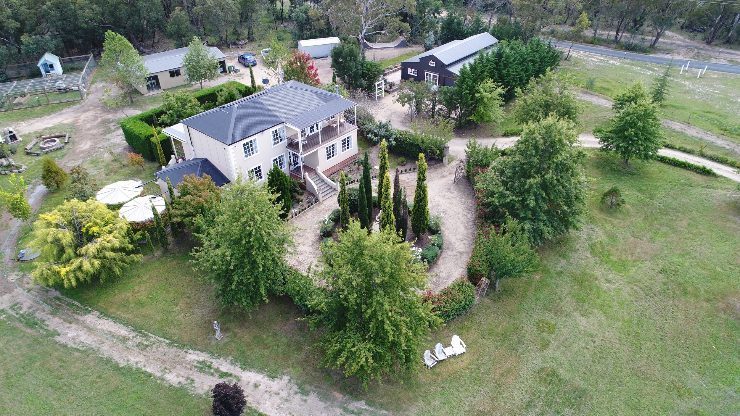 View of the grand manor and barn