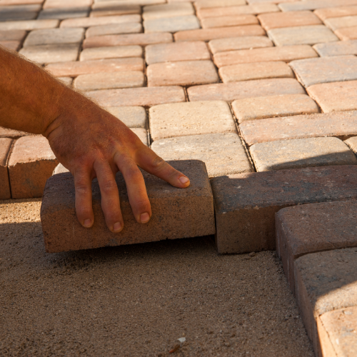 Paving being laid during landscape construction
