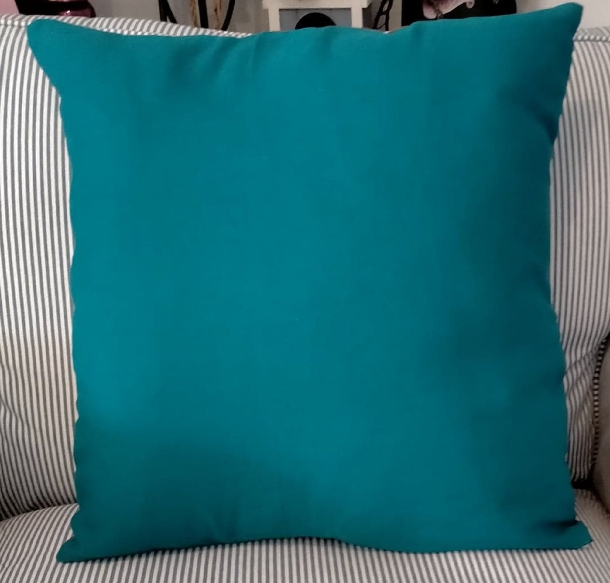 Love love love linen and cotton. Linen is a strong and textured fabric and when it is combined with cotton it has a little bit of a softer feel about it. The front of this cushion has a Teal Panel.