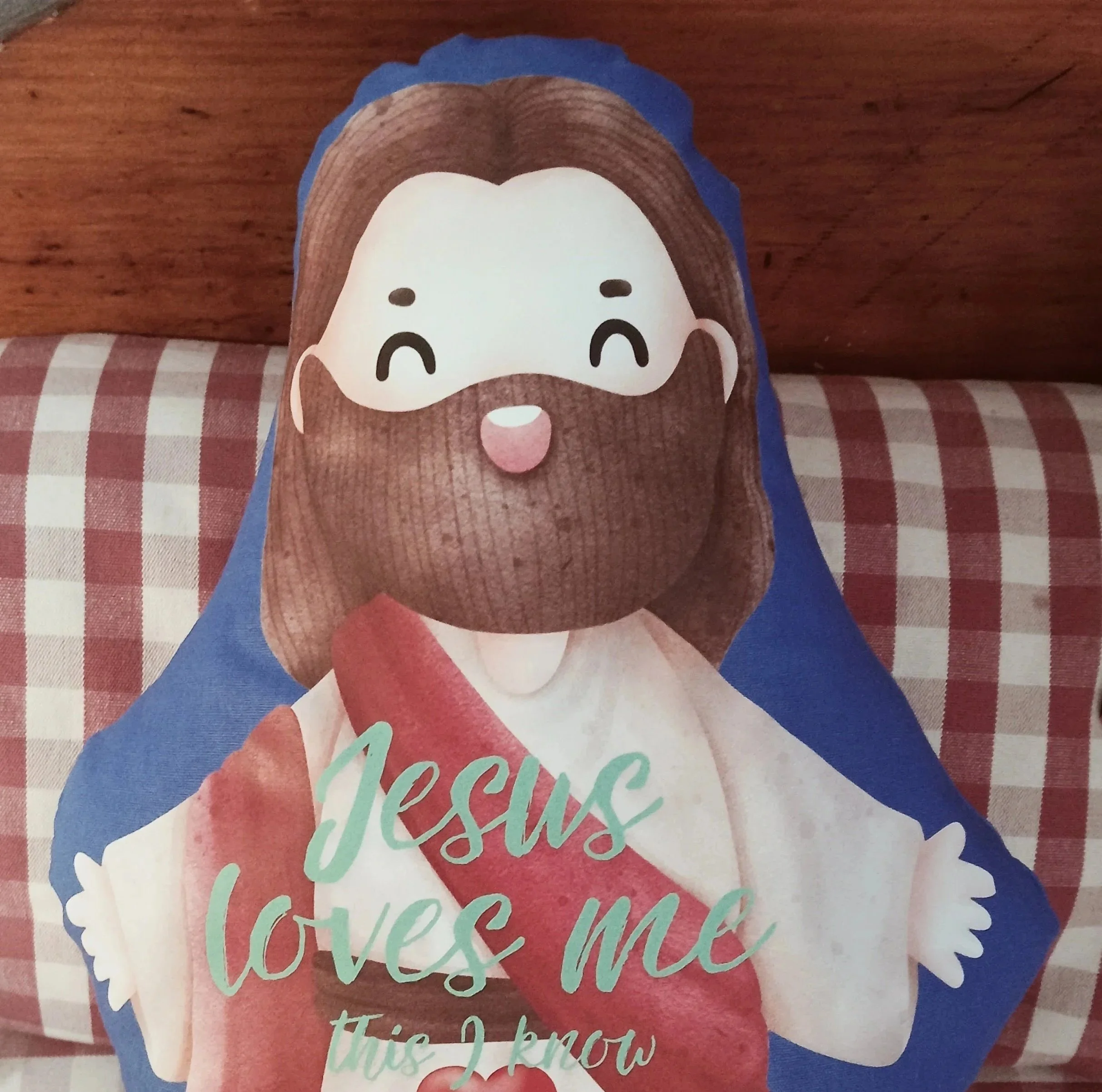 An adorable adaption of Jesus in the form of a huggable cushion. Comes with the phrase ‘Jesus loves Me This I know’ and three baby lamb’s on His lap. Soft and very huggable!