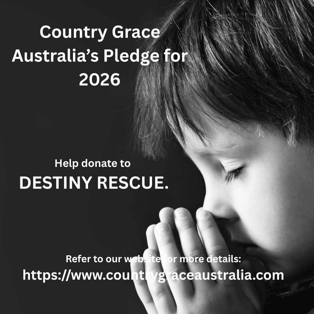 Black and white photograph of a young child with eyes closed, hands pressed together in prayer, with text promoting a pledge for 2026 and donation to Destiny Rescue on a dark background.