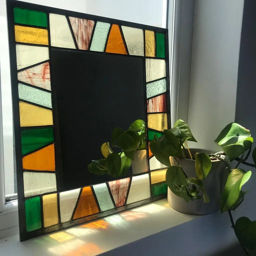  Large mirror using geometric shapes in colours to compliment the room’s decor. Selection of hand-cut textured glass.  