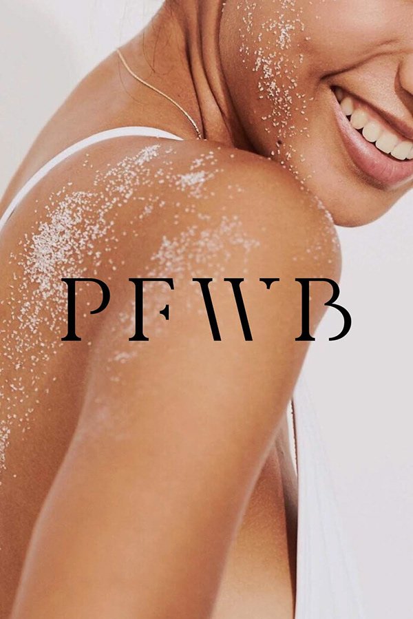 Close-up of a smiling woman with glitter on her shoulder and face, wearing a white top, with text 'PRIME' over her shoulder.