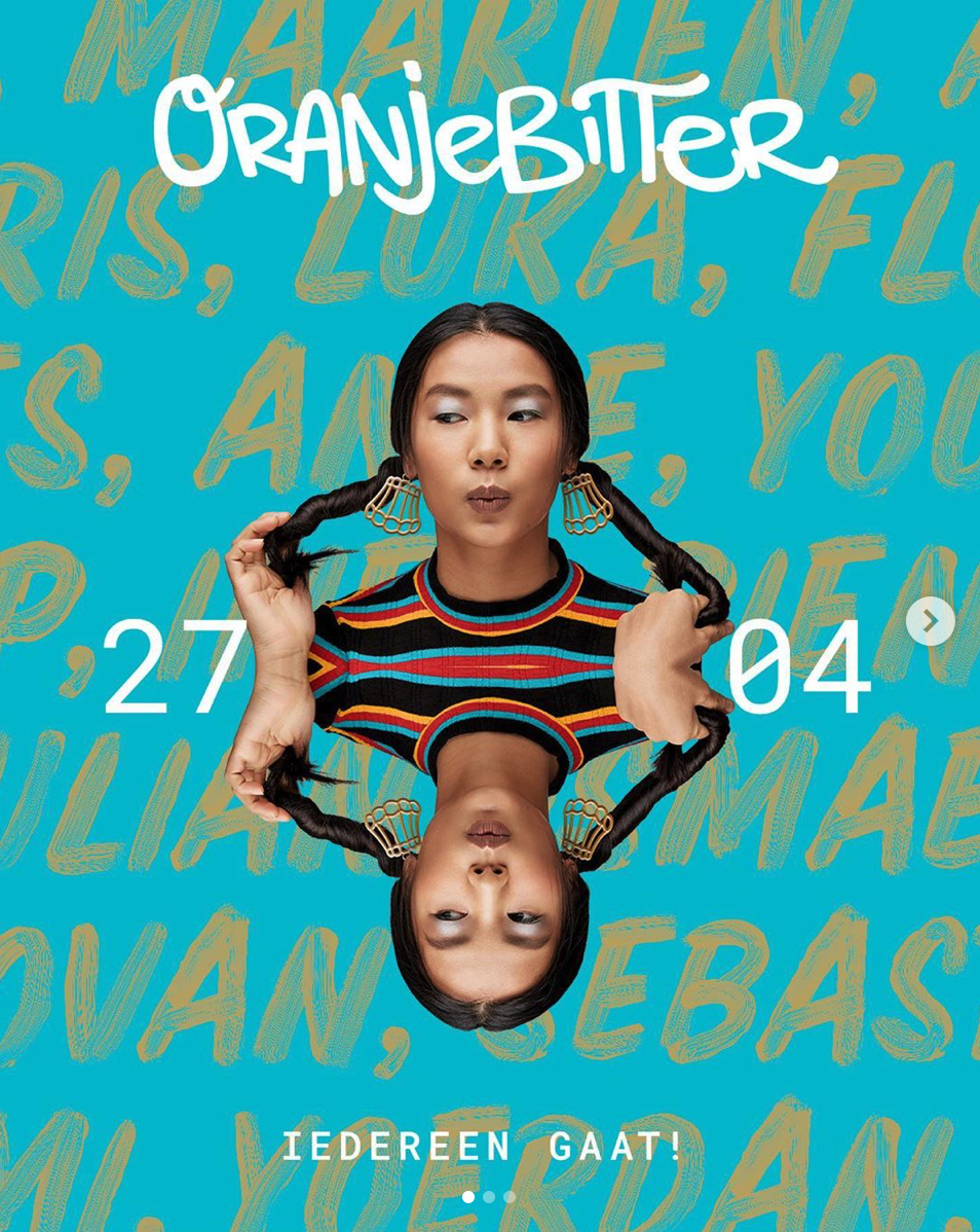 Event poster with a blue background featuring a woman with long braids, wearing colorful striped shirt, and large earrings, holding one braid in each hand. Overlapping her image is a mirrored reflection, creating a symmetrical effect. Behind her are 