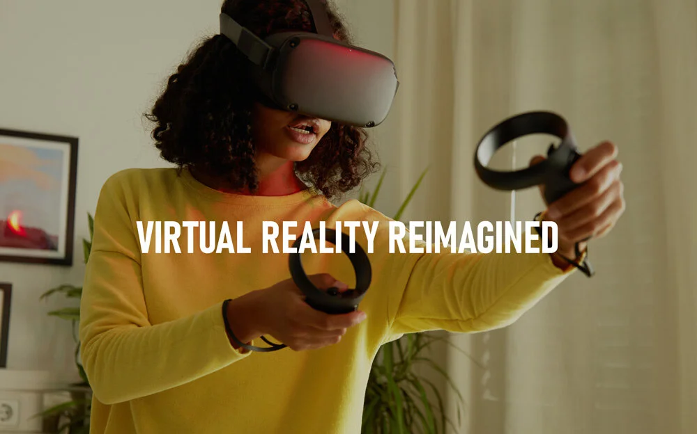 A woman wearing a yellow sweatshirt and VR headset holding VR controllers, engaging in a virtual reality experience in a room with Curtains, plants, and pictures on the wall.