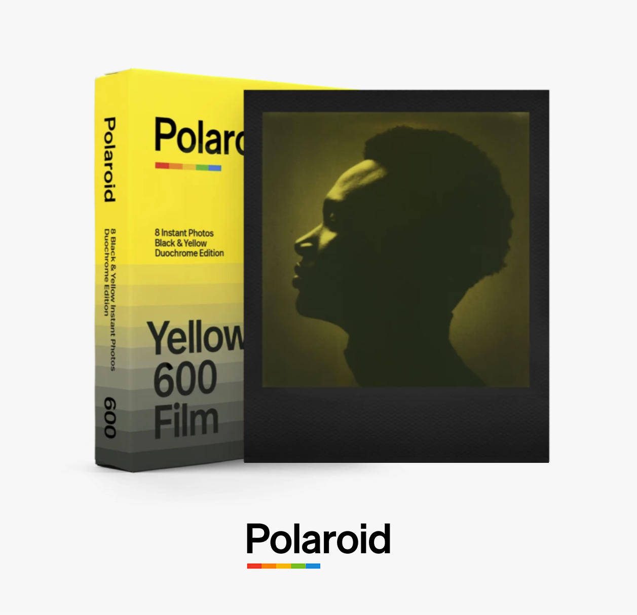 A Polaroid film box with a black silhouette of a woman’s profile on the front, yellow and black packaging, and the text 'Polaroid 600 Yellow Film' on the box.
