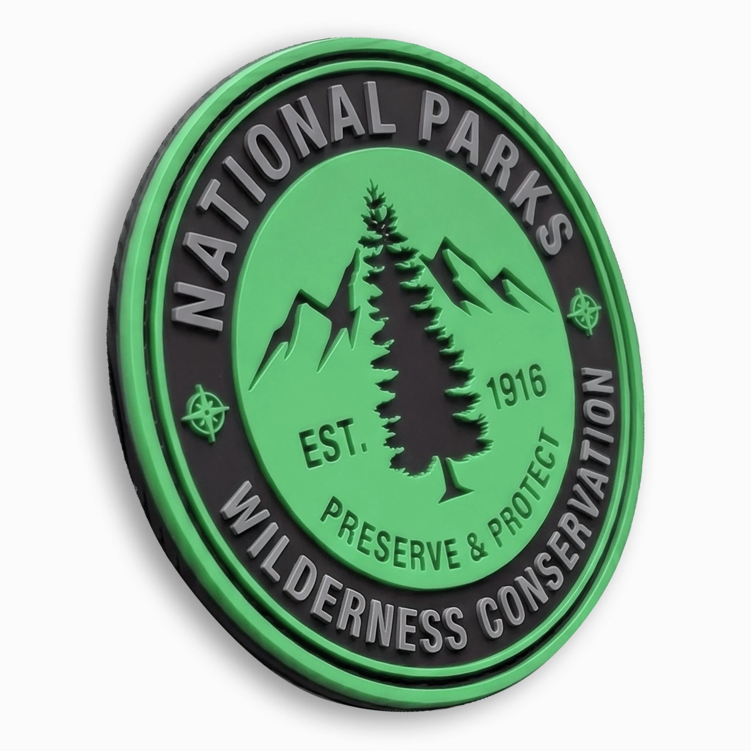 Badge with green border and black background, displaying the text 'National Parks' and an outline of a pine tree