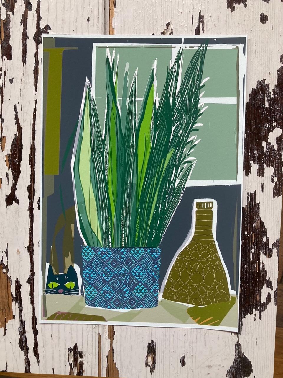 Black cat and Houseplant