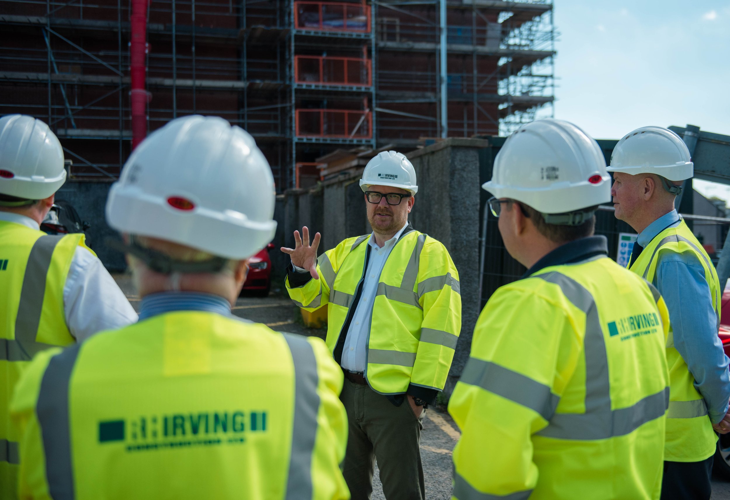Midsteeple Quarter executive director Scott Mackay, centre, talking through work on the construction site at 135-139 High Street, Dumfries.jpg