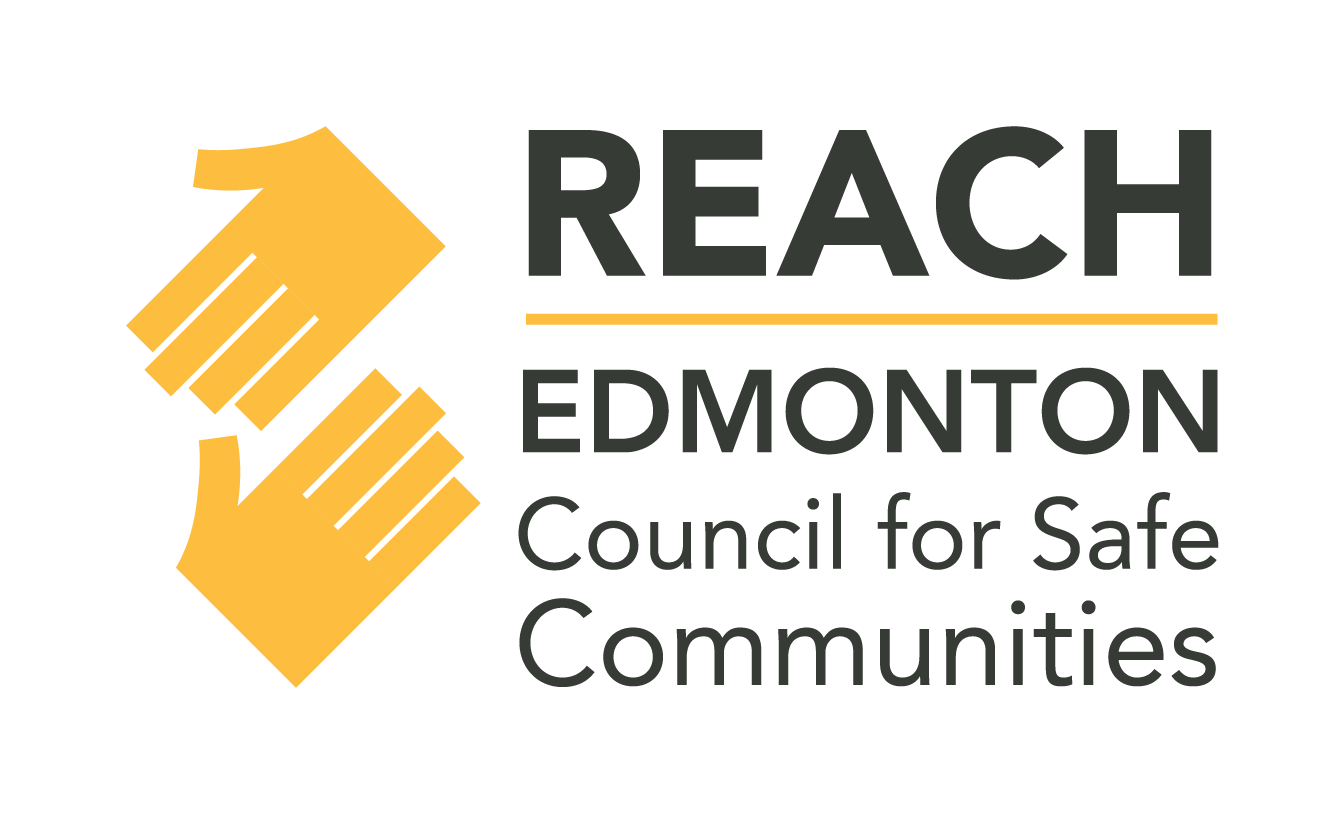 Logo for Reach Edmonton Council for Safe Communities featuring two yellow hands gripping each other's fingers, with text to the right that says 'REACH EDMONTON Council for Safe Communities'.