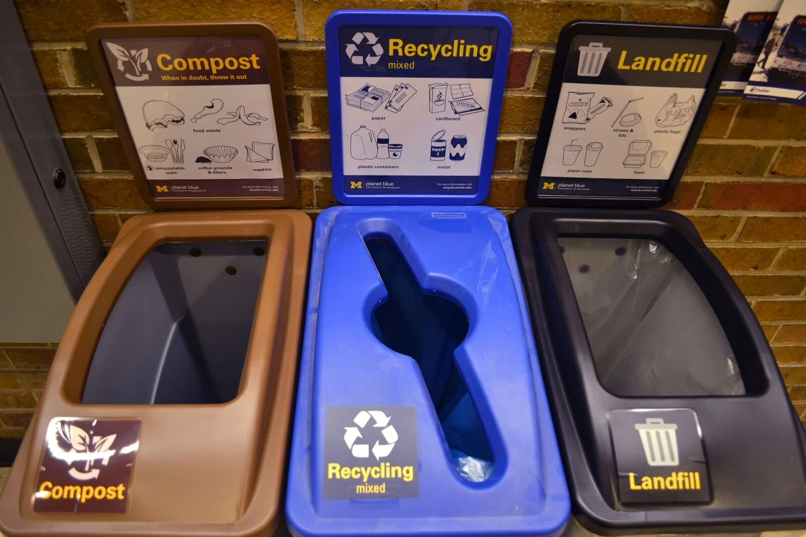 Waste &amp; Recycling Bins with informative signage to inform occupants.