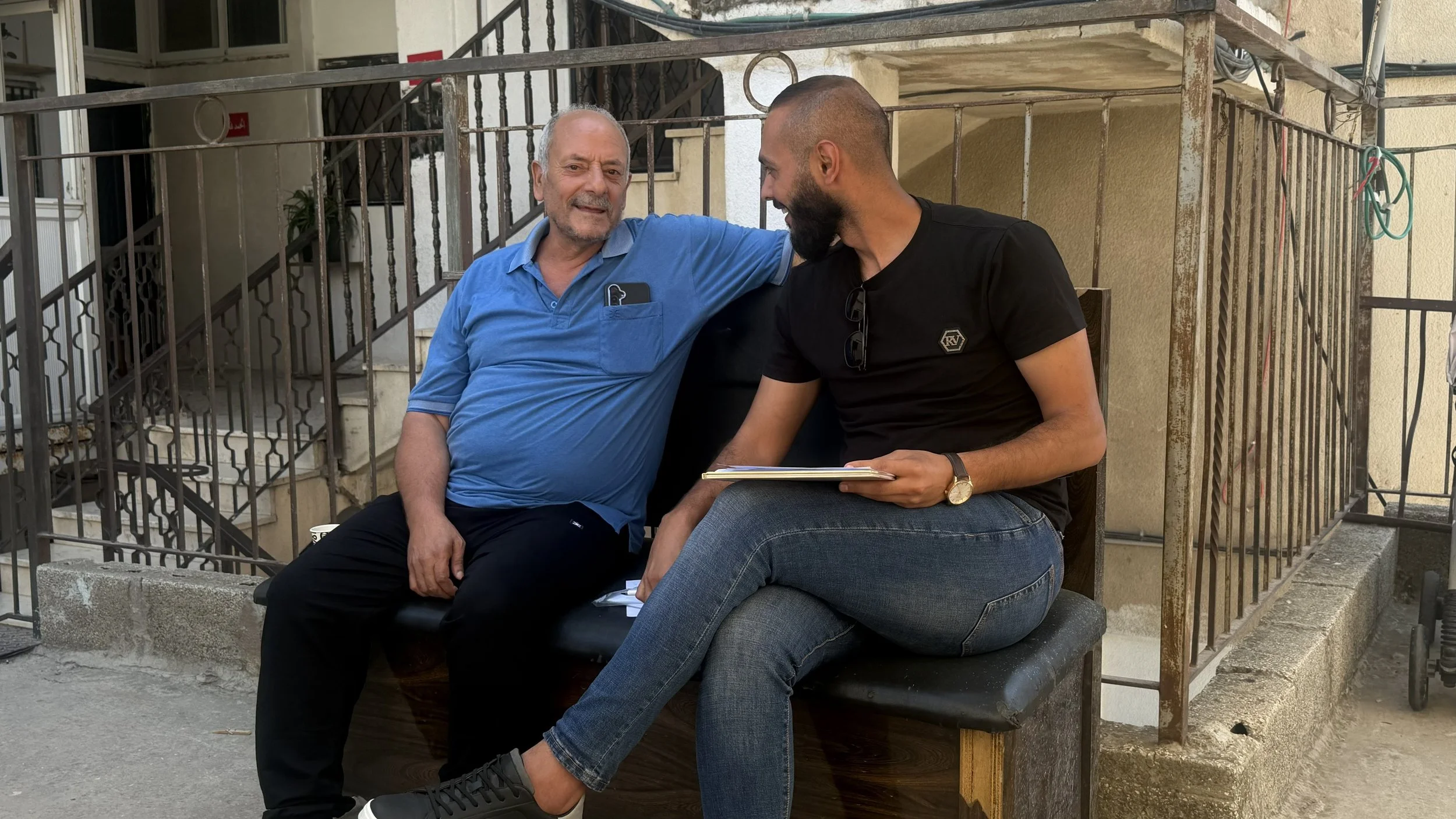 A garden host with a Health 4 Palestine community health worker.