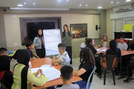 Here Summer Camp participants learn about pollution & environmental hazards. During the week they also gained new abilities in making public presentations. This will help them in the future as they continue to develop their professional skills.