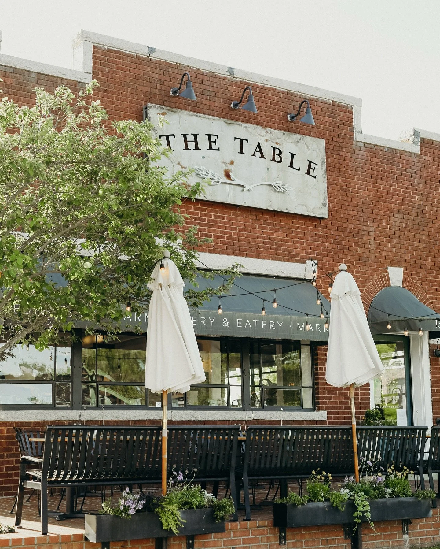 Summer lingers here&hellip;
&bull;
Conversations stretch longer, the summer air hums, and community gathers both inside and out.
&bull;
From our open patio, with its umbrellas, fans, and one beloved tree, to our enclosed patio in the back, to our bri