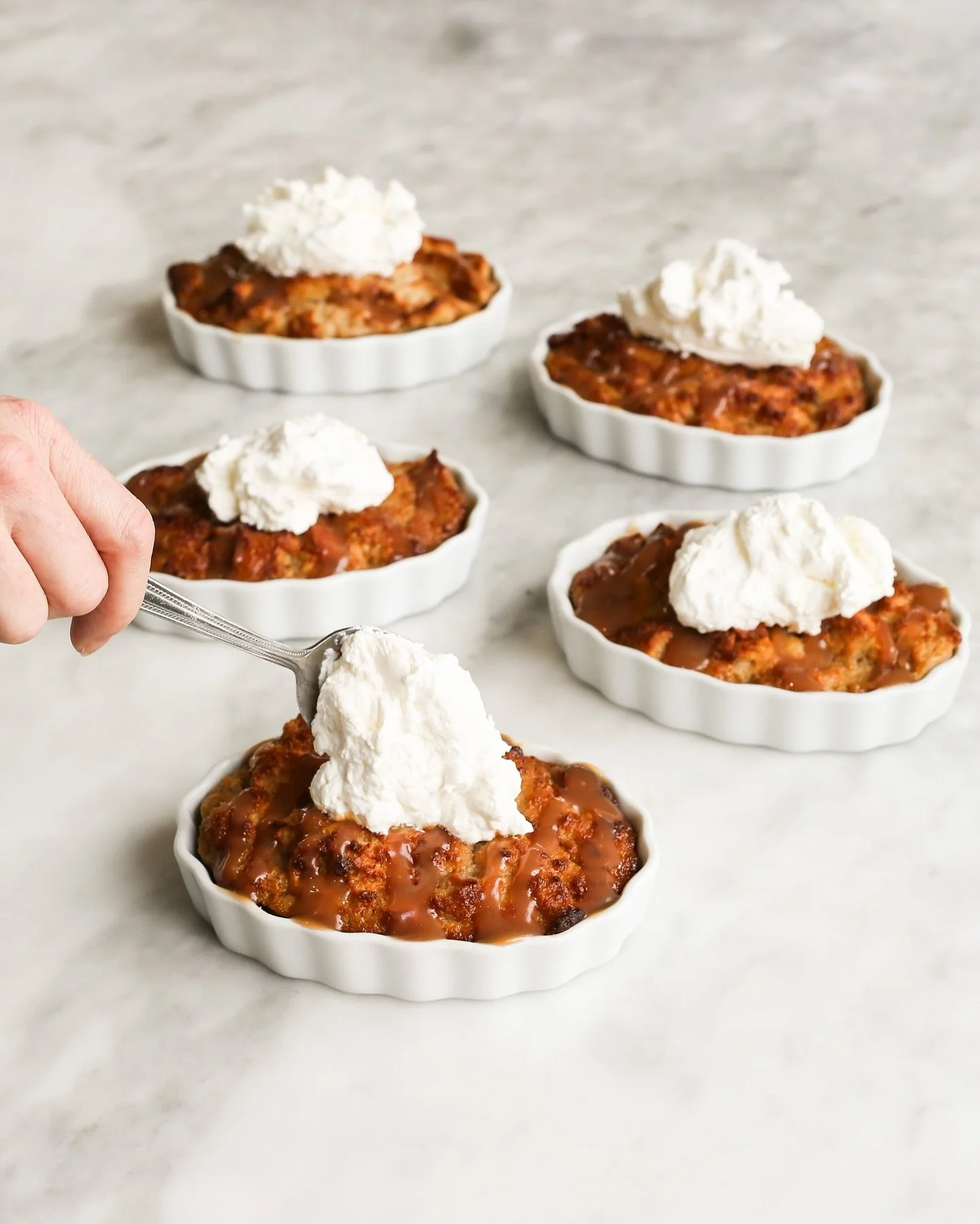 Starting tonight at The 𝐸𝓋𝑒𝓃𝒾𝓃𝑔 Table, enjoy a comforting Southern classic&mdash;Vanilla Bean Bread Pudding! Topped with caramel drizzle and a cloud of whipped cream, each one is baked individually and perfectly sized to share. Cozy up with th