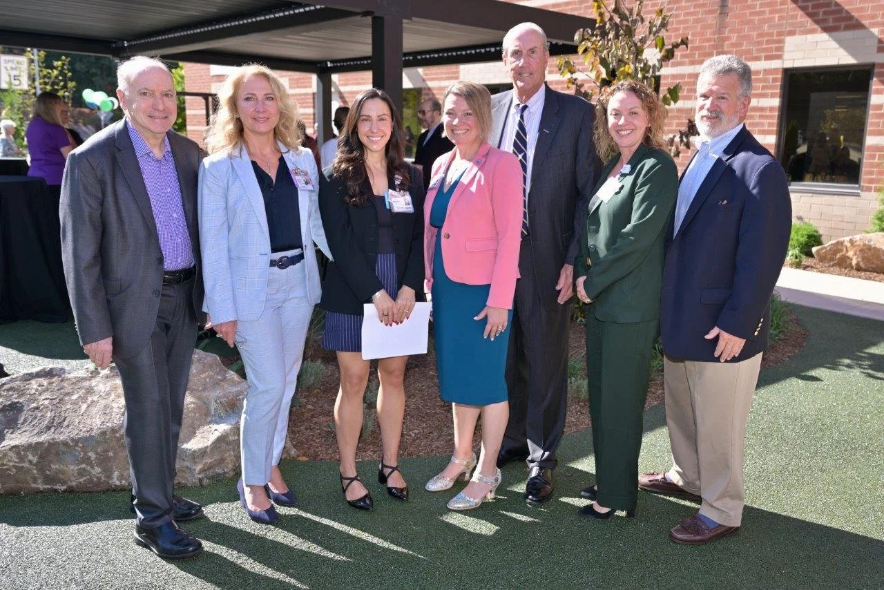 Phelps board and staff at ribbon cutting web-sized.jpeg