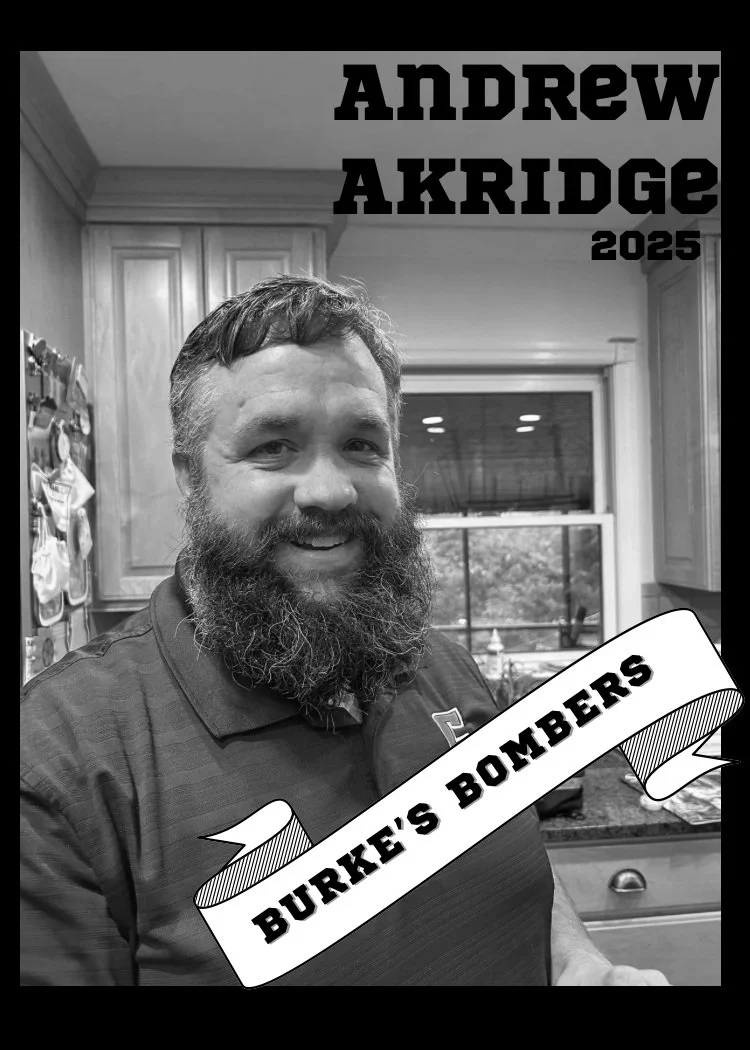 Black and white photo of a man with a beard smiling in a kitchen, with text overlay reading "Andrew Akridge 2025" and a banner saying "Burke's Bombers."