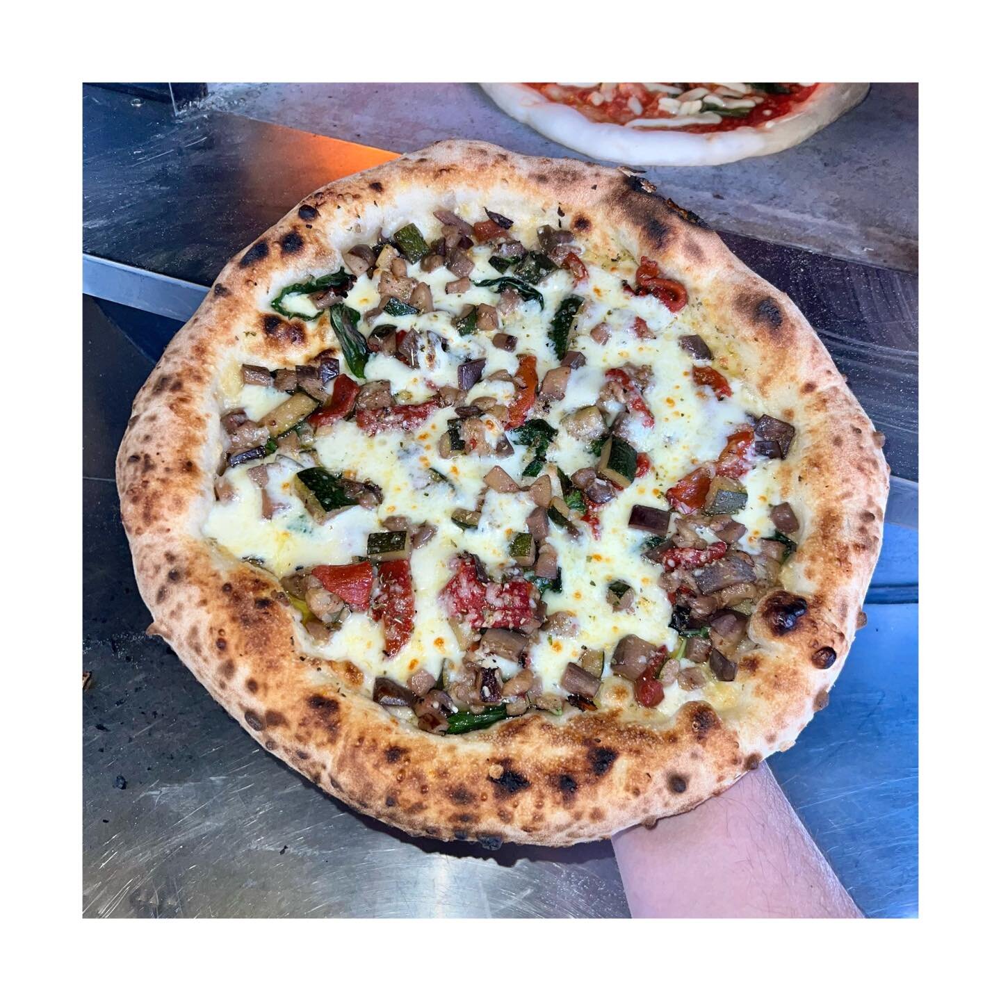 This month's special 🔥

- Parmigiano Reggiano
- Basil
- A mix of aubergine, courgette, and peppers
- Provolone cheese
- Fior di latte
- Wild Calabrian oregano
- A healthy drizzle of EVOO

Can't decide which pizza to try this month? Come give our spe