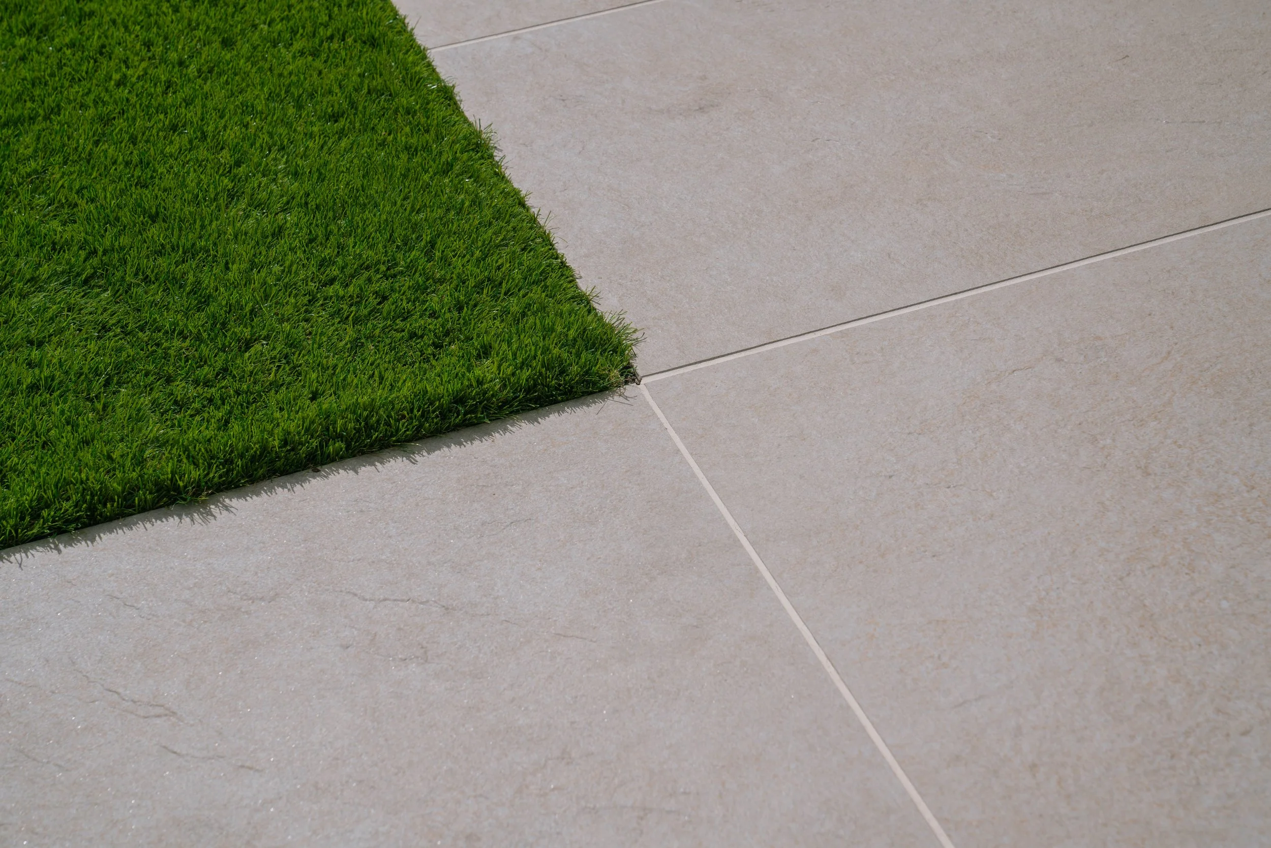 High-quality artificial grass providing a zero-maintenance, year-round green lawn in a London urban garden