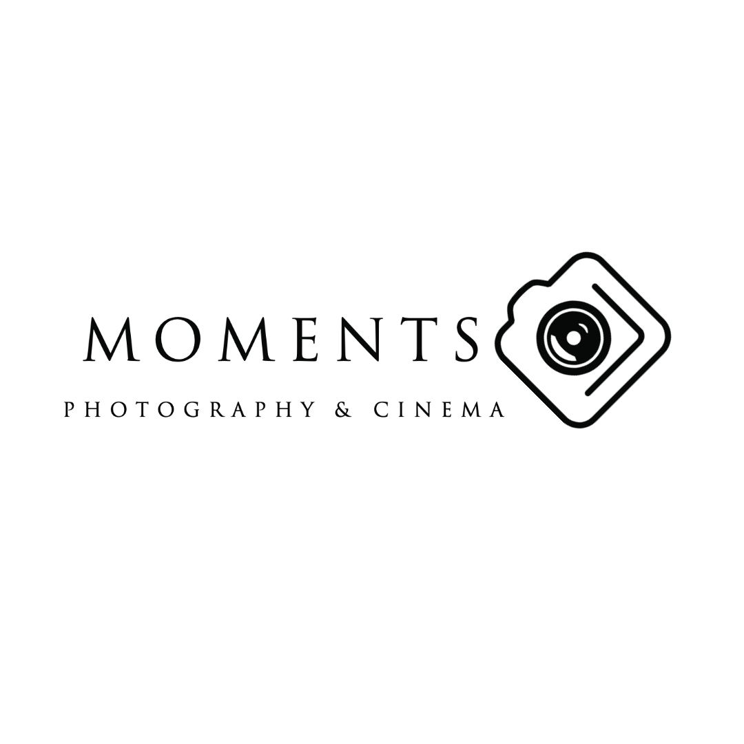 Black background with white text that reads "Moments" and features an icon of a camera.