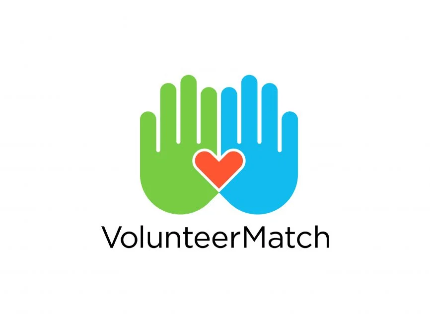 Logo with two overlapping hands, one green and one blue, with a red heart in the center, and the word "VolunteerMatch" below.
