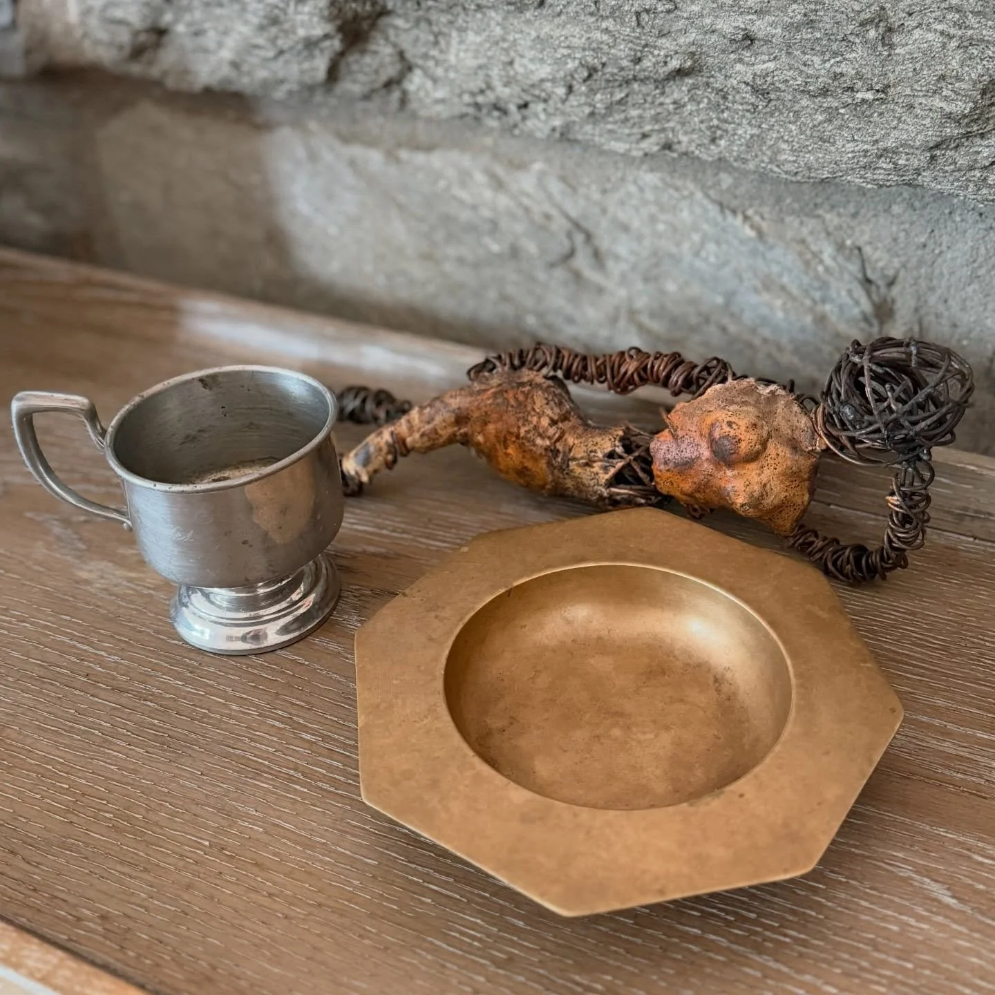 Is it a tchotchke? Is that a RueLALA? To me, these are all objects of art that each tell a different story. 
Vintage tennis trophy $25 
Brass ashtray $25
Wire and ceramic sculpture $125