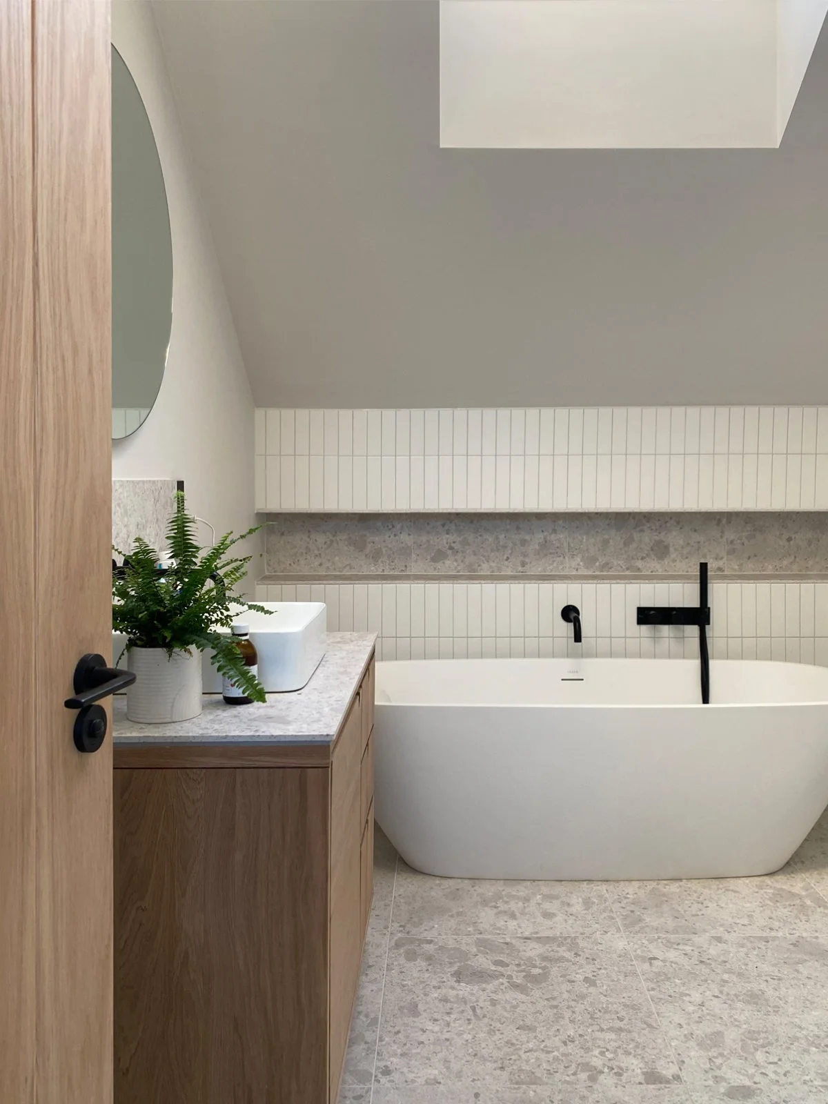 Interior view of a newly fitted bathroom in a historic building, showcasing sensitive heritage design and interior remodelling by architects in Bath specialising in listed building repair and conservation projects.