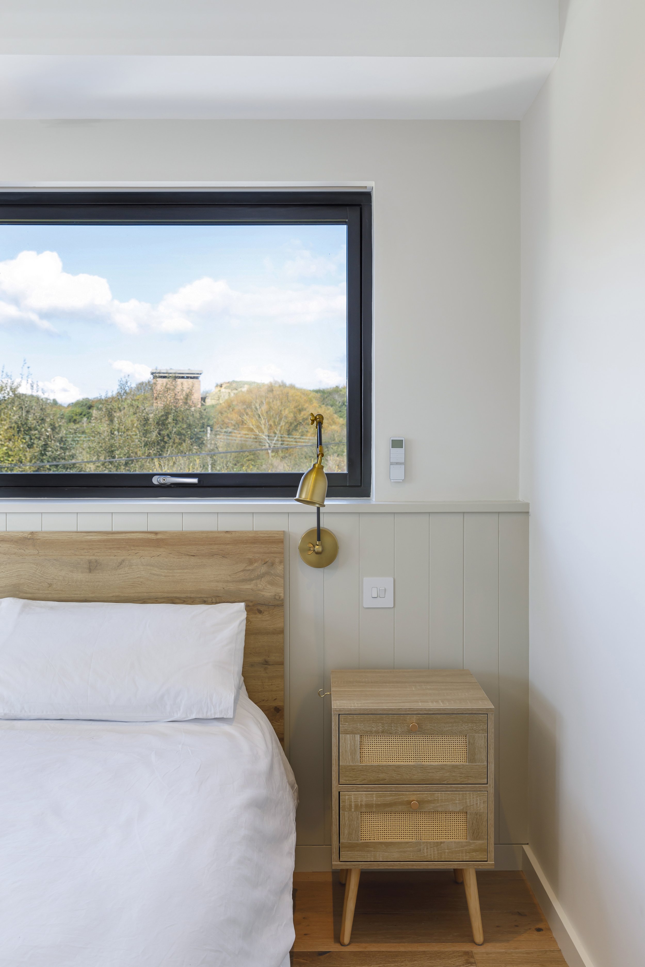 Beach house with framed bedroom views to historic landscape.jpg