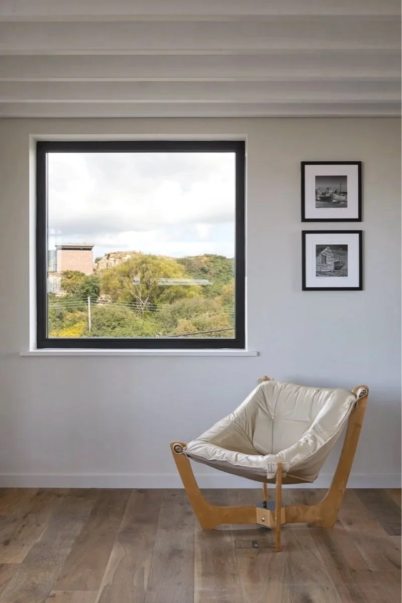 Interior photo of new build eco house overlooking historic landscape designed by architect studio four point ten who serve Frome in Somerset