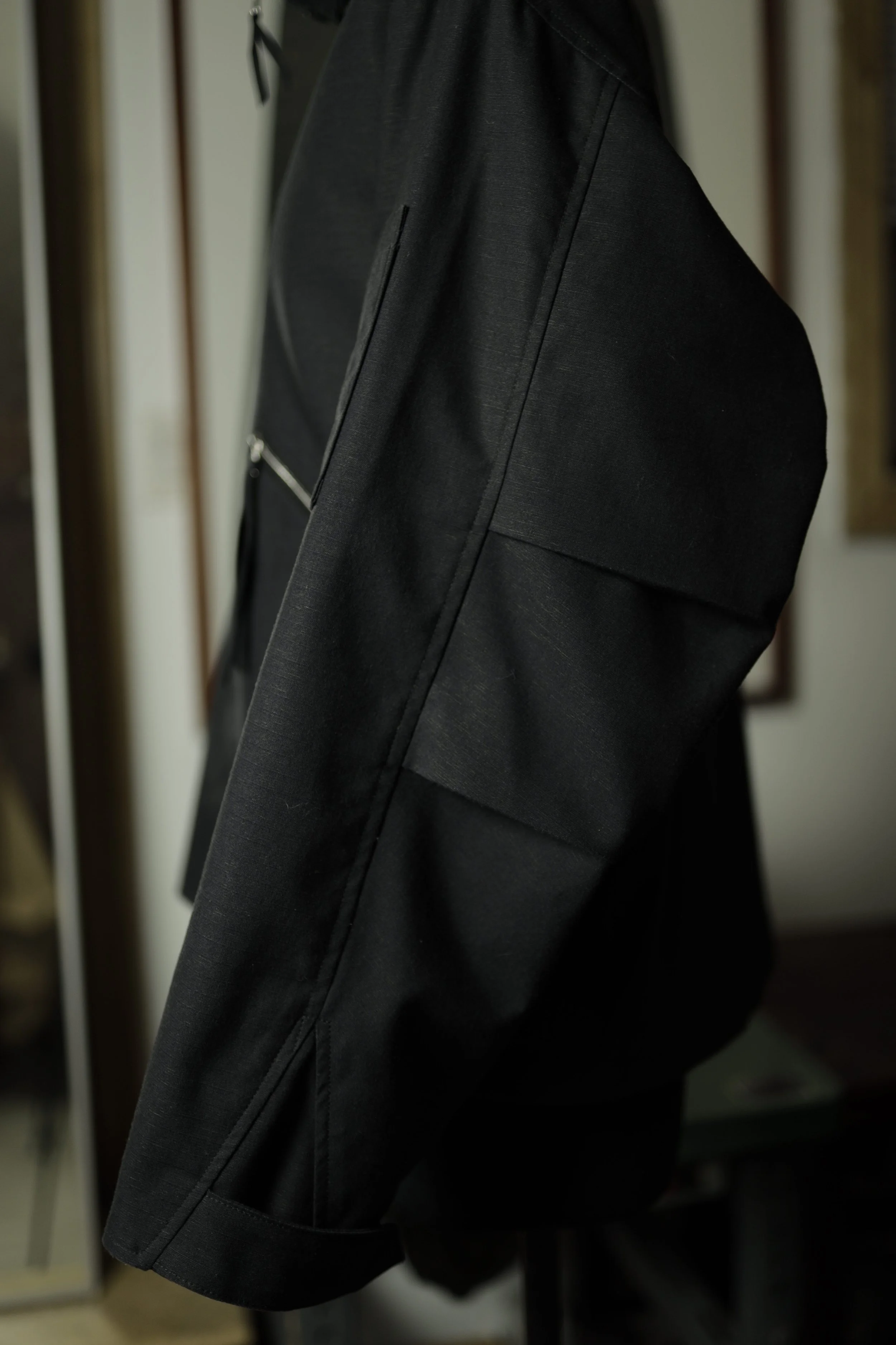 Navigator Jacket sleeve and elbow panel detail in black cotton ripstop.
