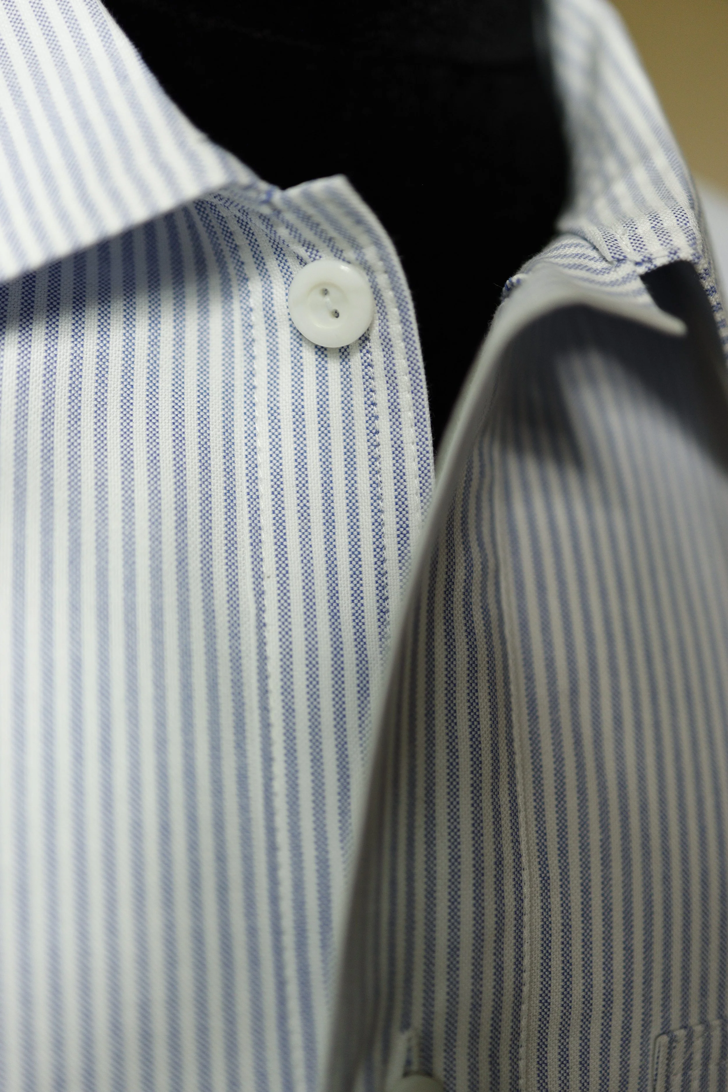 Close-up of the Ocean Blue Cotton Oxford Pullover Shirt collar featuring premium Oxford cotton, fine blue pinstripes, and a clean button-front design.