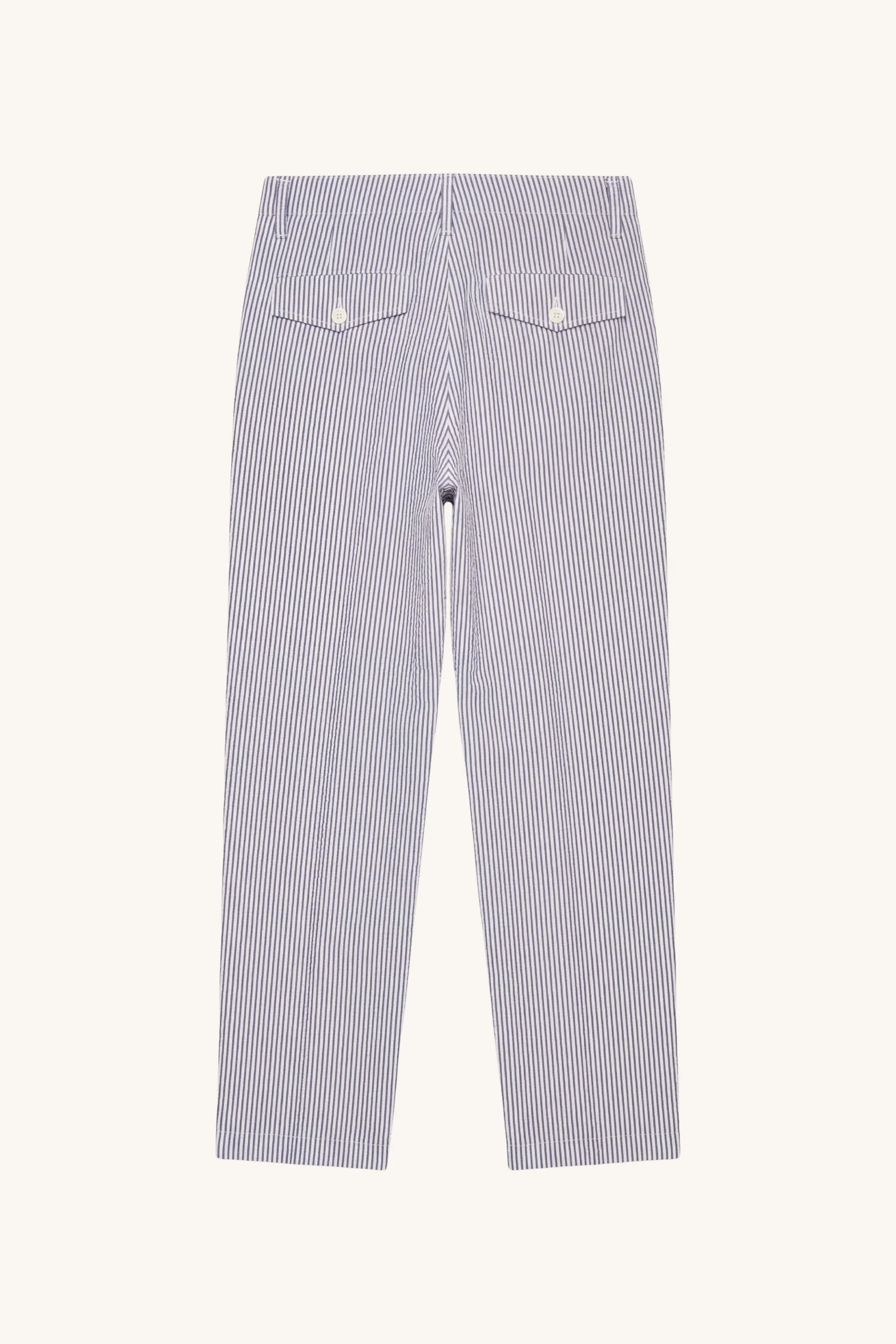 Front view of indigo seersucker military chino trousers with vertical stripe texture and straight leg silhouette