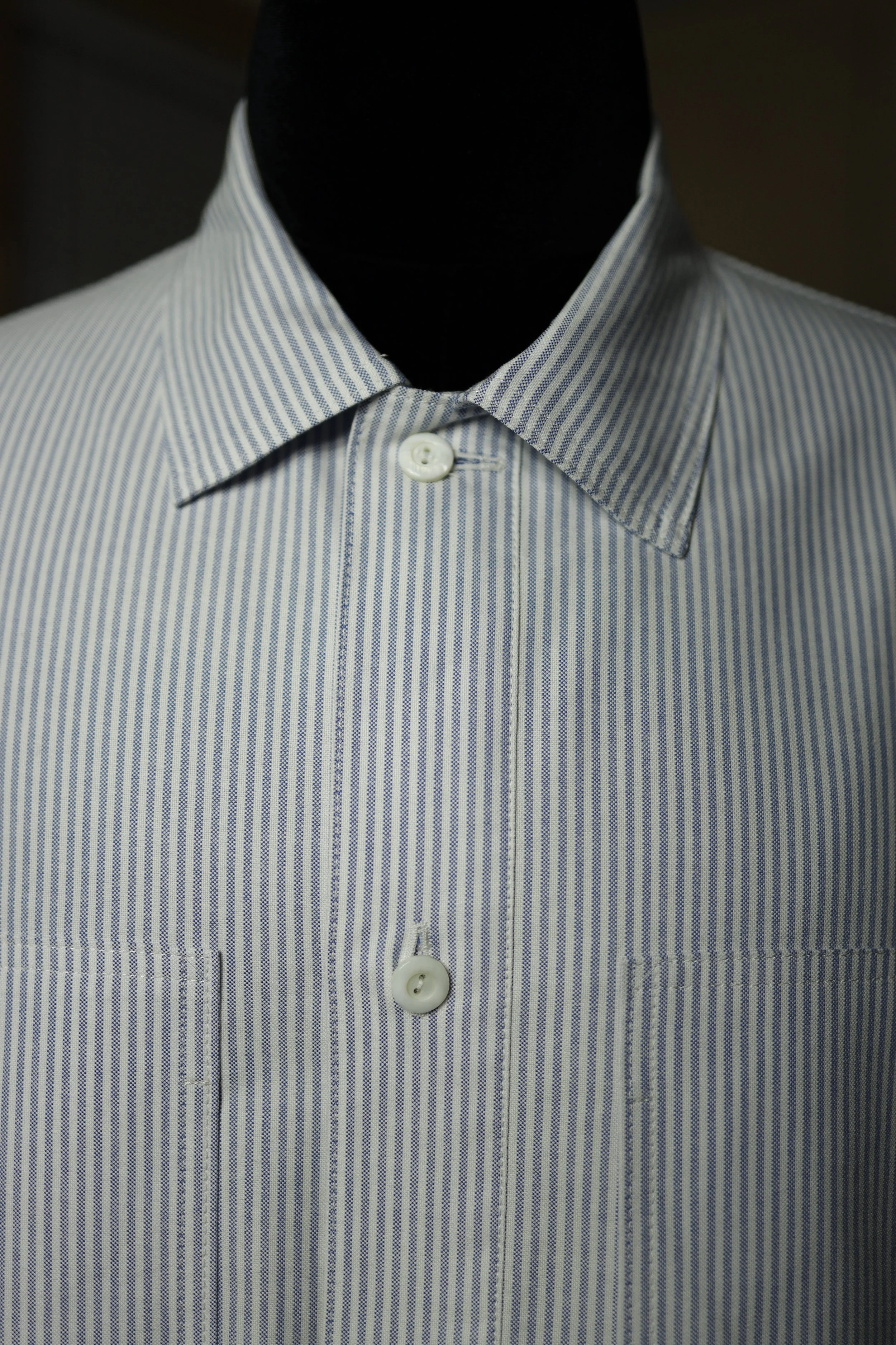 Ocean Blue Cotton Oxford Pullover Shirt front view featuring oversized utility pockets, relaxed silhouette, and classic blue striped Oxford cotton construction.