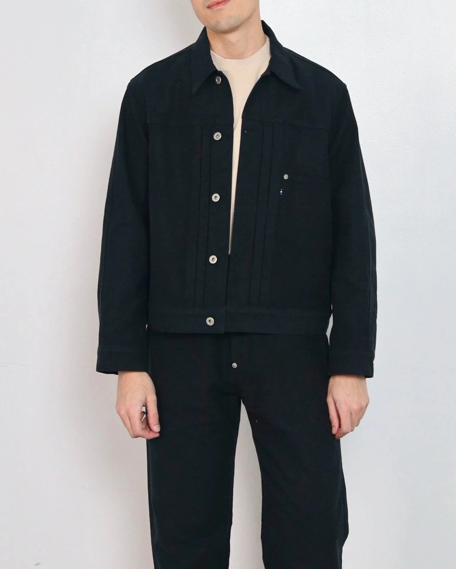 Cotton moleskin work jacket showing front patch pocket and exposed buttons