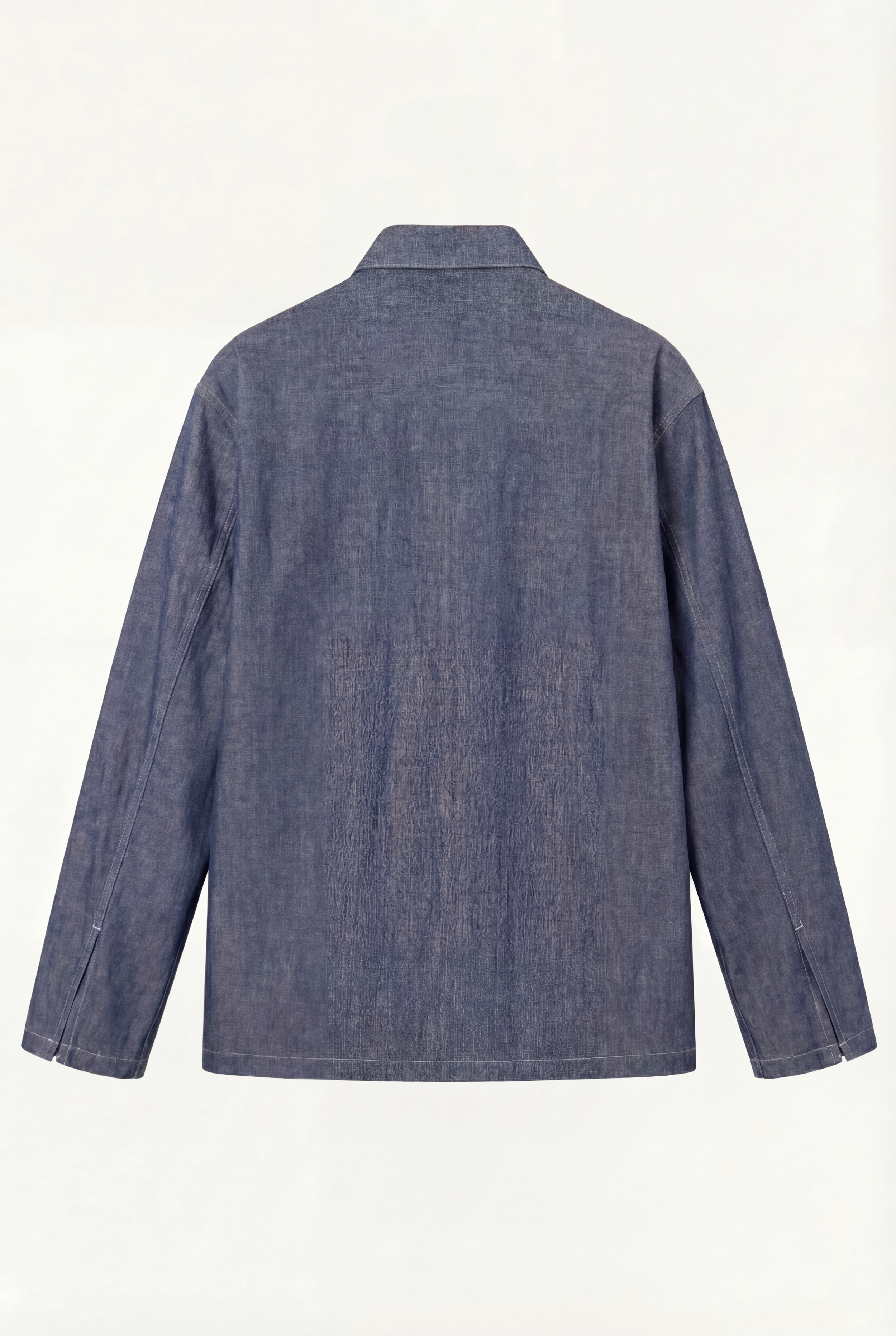 Back view of [ko'lon] Bennet Popover Chambray shirt showing straight hem, boxy silhouette, and cotton chambray fabric