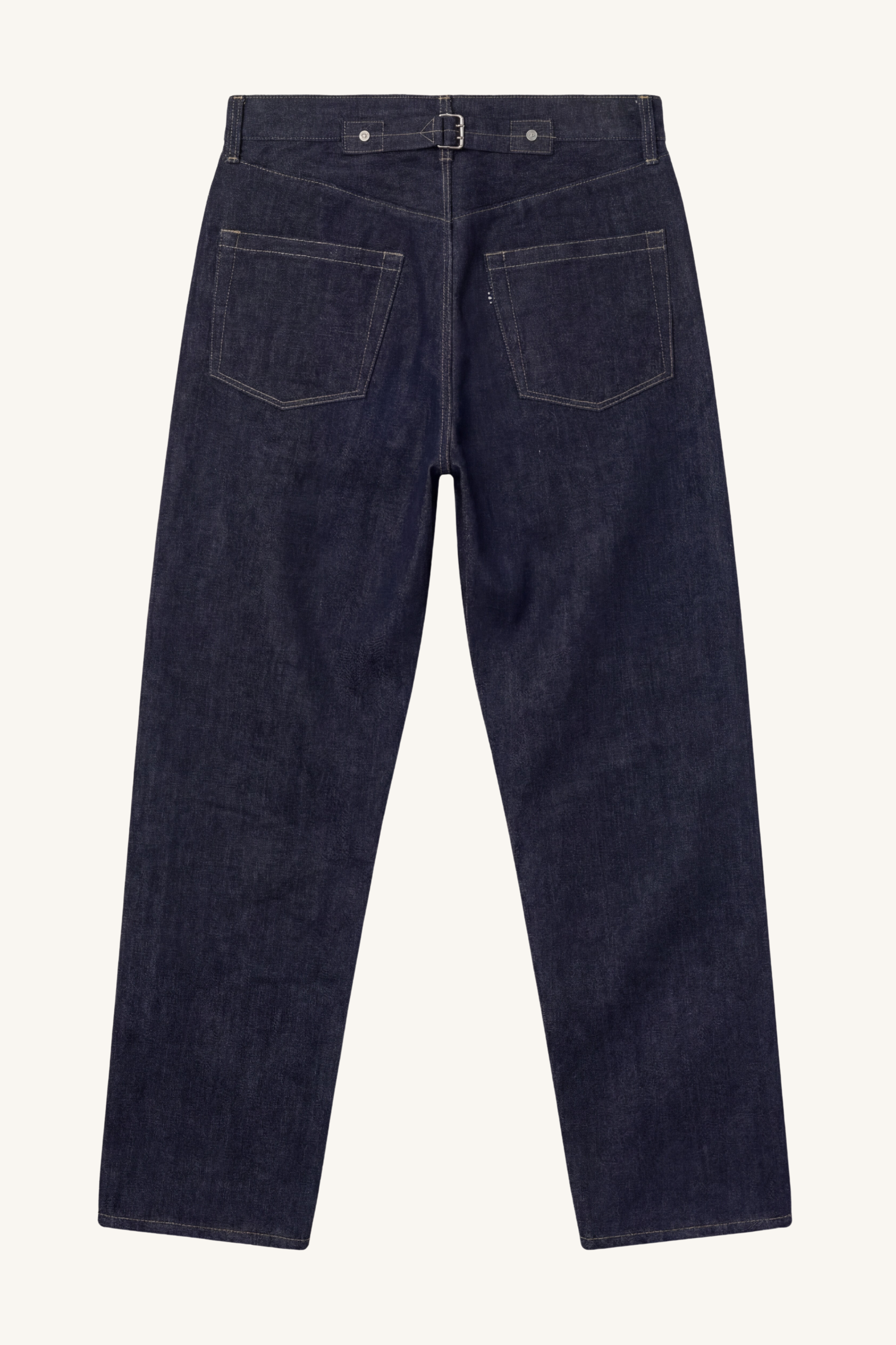 Back view of [ko'lon] Indigo selvedge denim jeans featuring classic five‑pocket layout, back cinch buckle, and straight‑leg silhouette