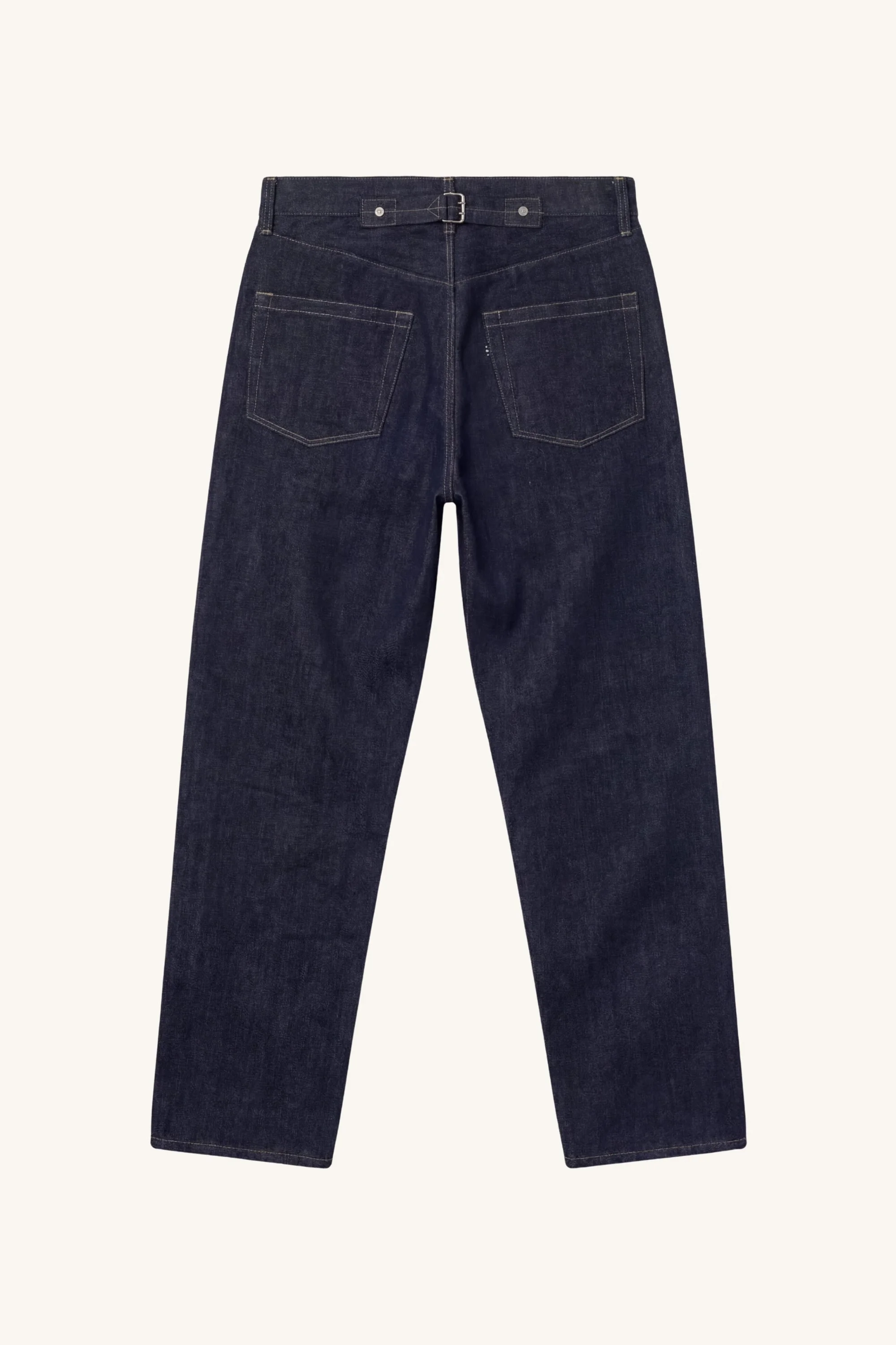 Back view of [ko'lon] Indigo selvedge denim jeans featuring classic five‑pocket layout, back cinch buckle, and straight‑leg silhouette