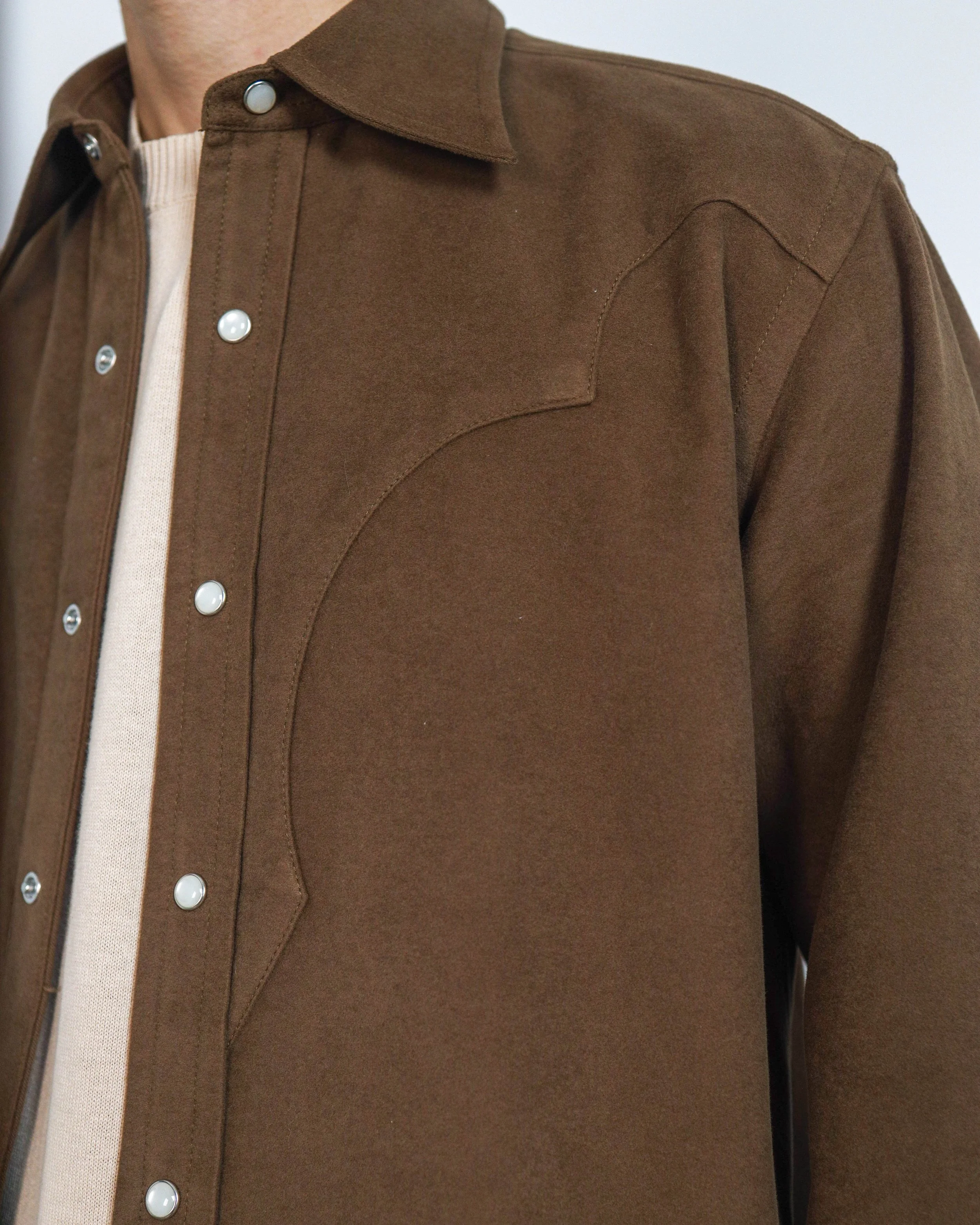 Close‑up of western yoke and pearl snap details on the Moleskin Western Shirt.