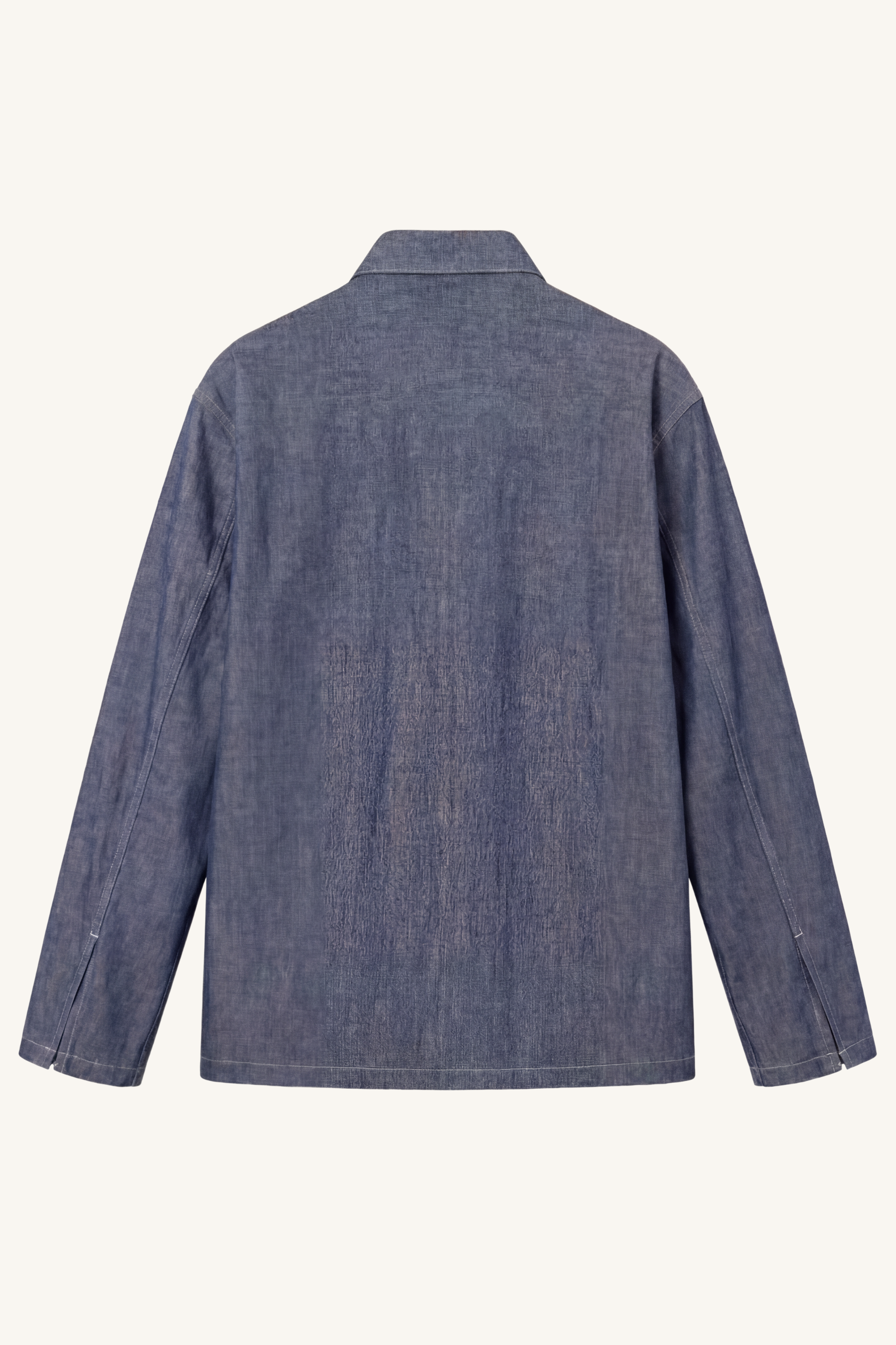 Back view of [ko'lon] M‑35 chambray popover shirt featuring clean construction, boxy fit, and timeless workwear profile