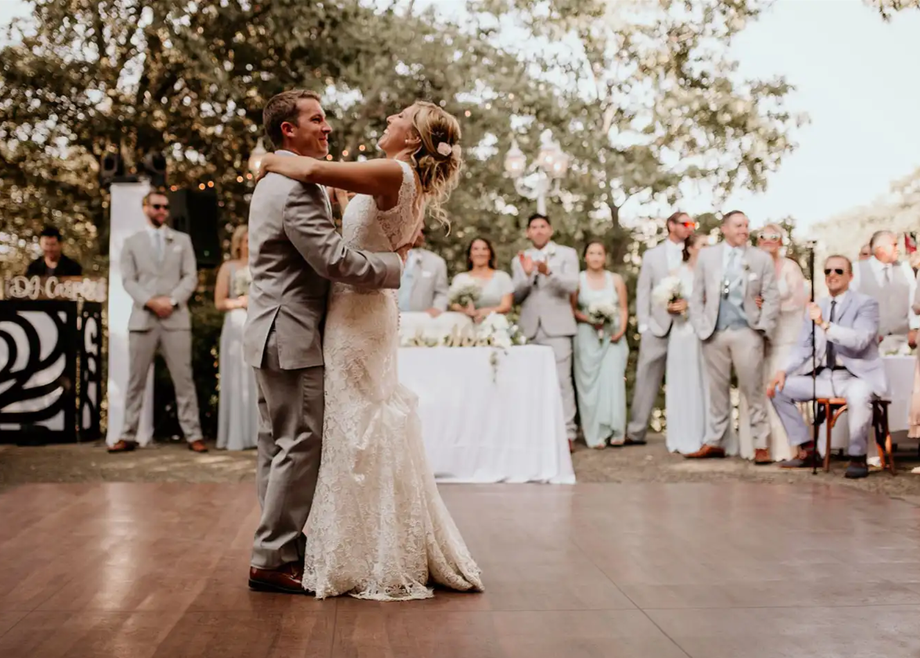 Bride and Groom Dancing on top of Dark Maple Dance Floor