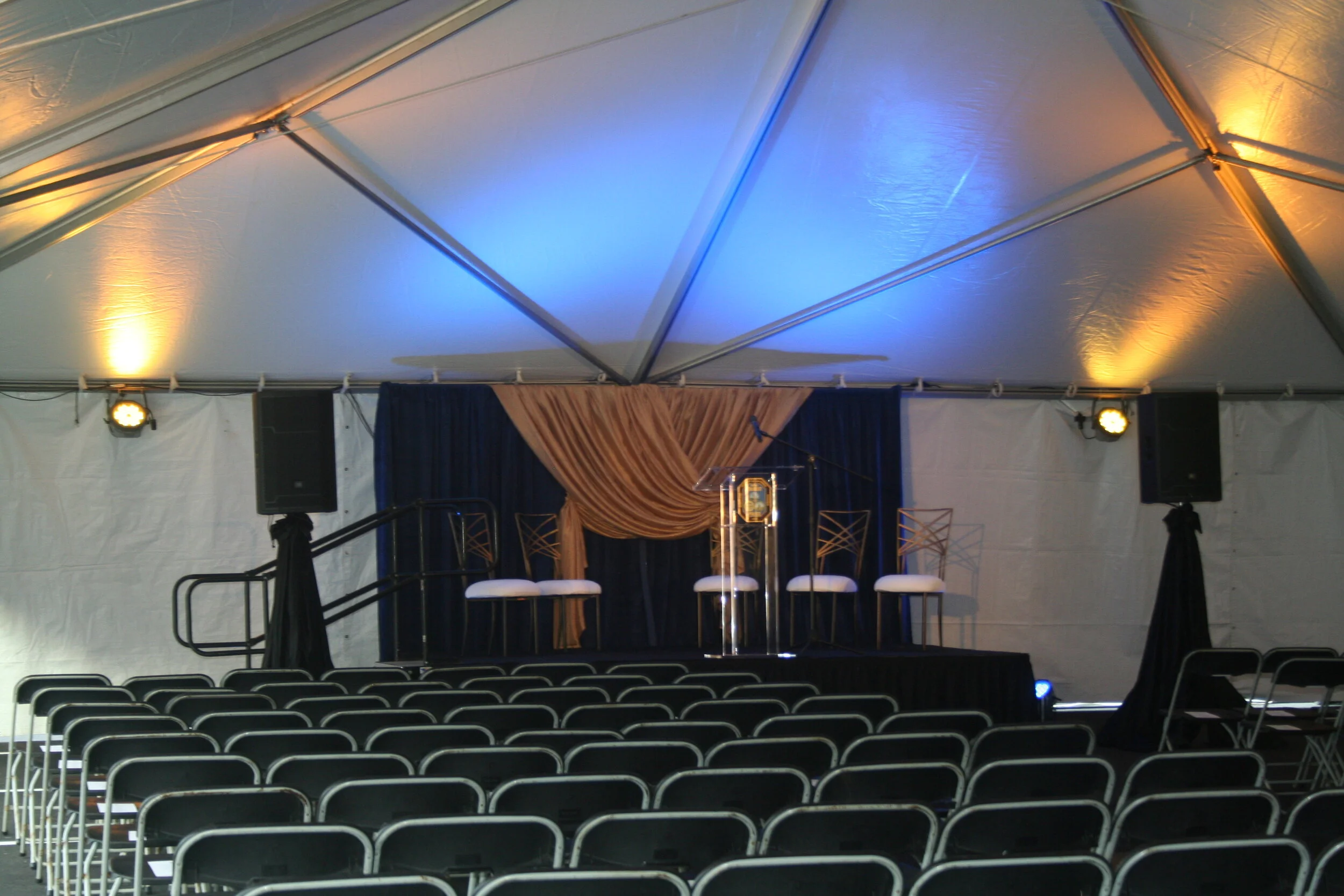 inside of tent with chairs and lighting