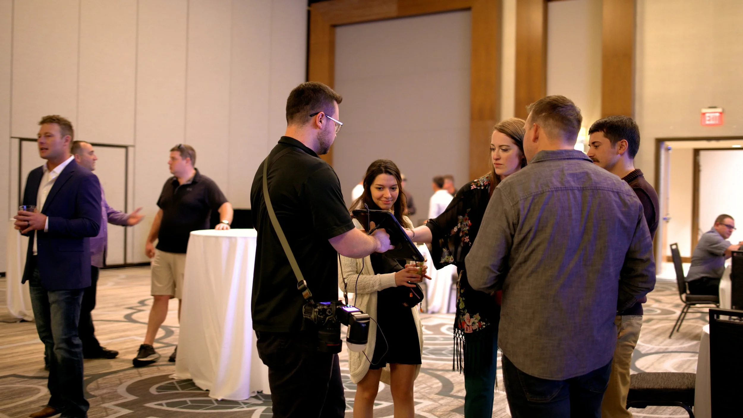 OneAway Studios Instant Photo Experience engaging with guests at a corporate event.